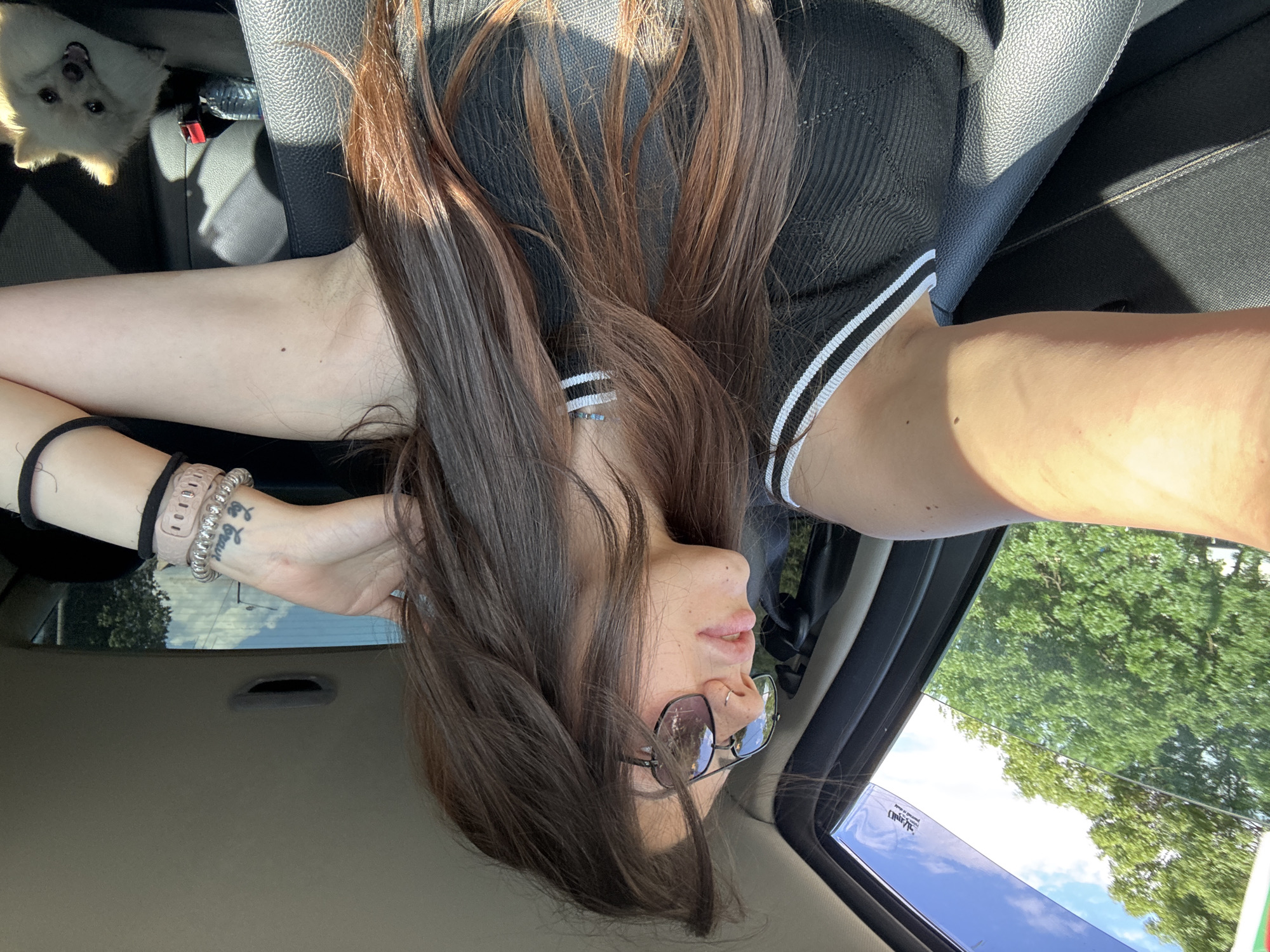 Two women chat and take selfies in car in Sofia