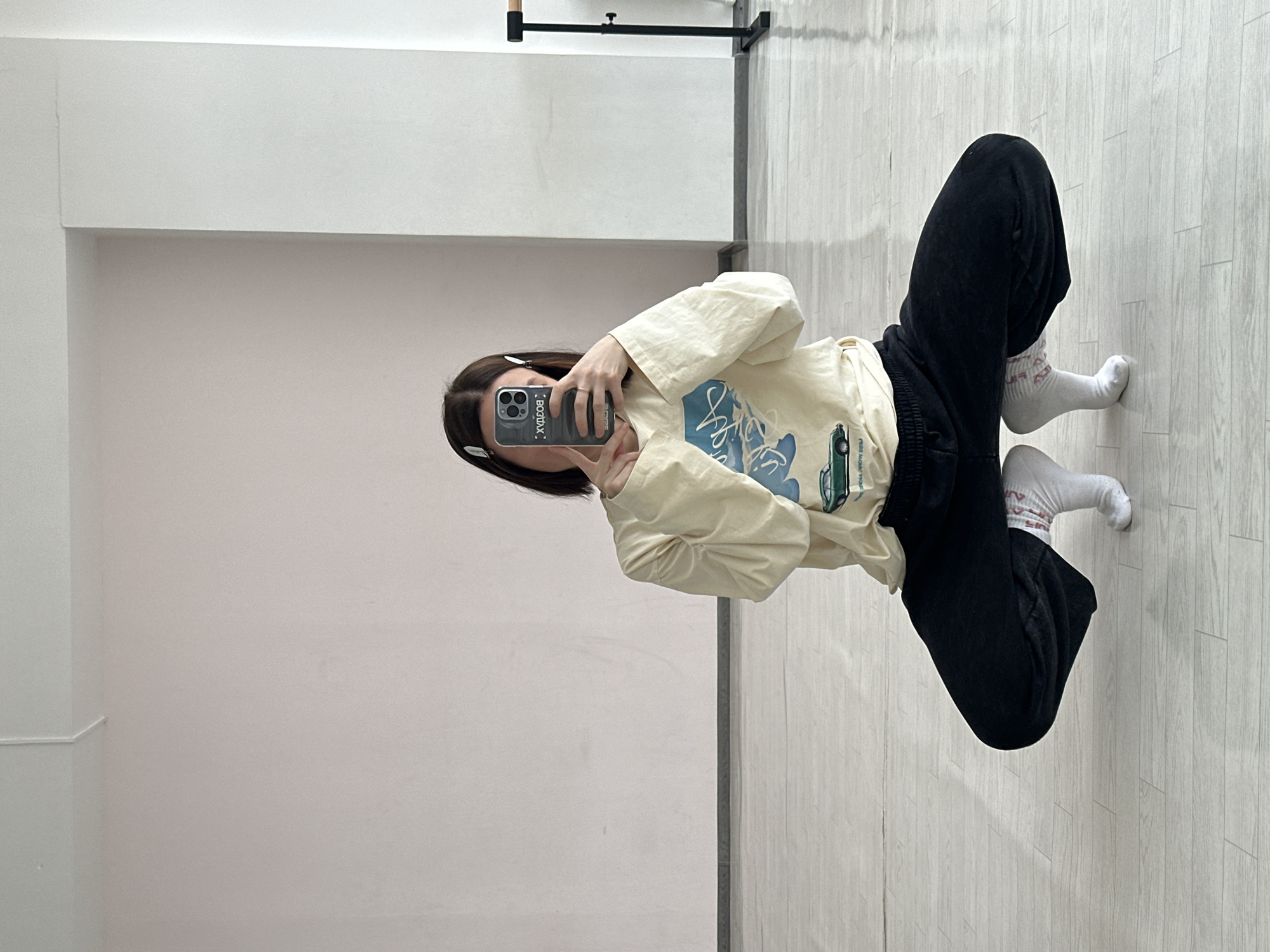 Woman takes selfies in indoor space in Votkinsk