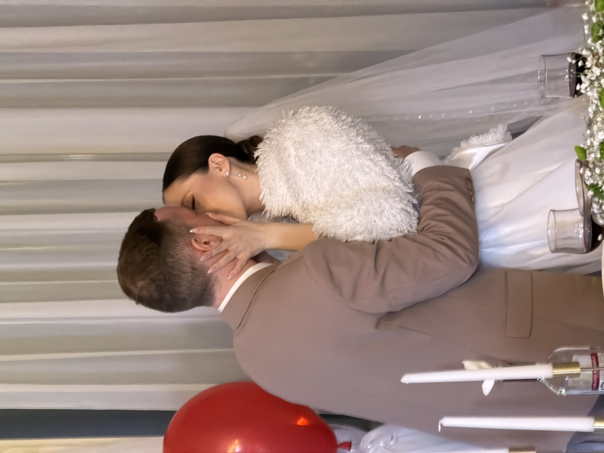 Wedding couple photographed kissing in Chaikovsky, Russia