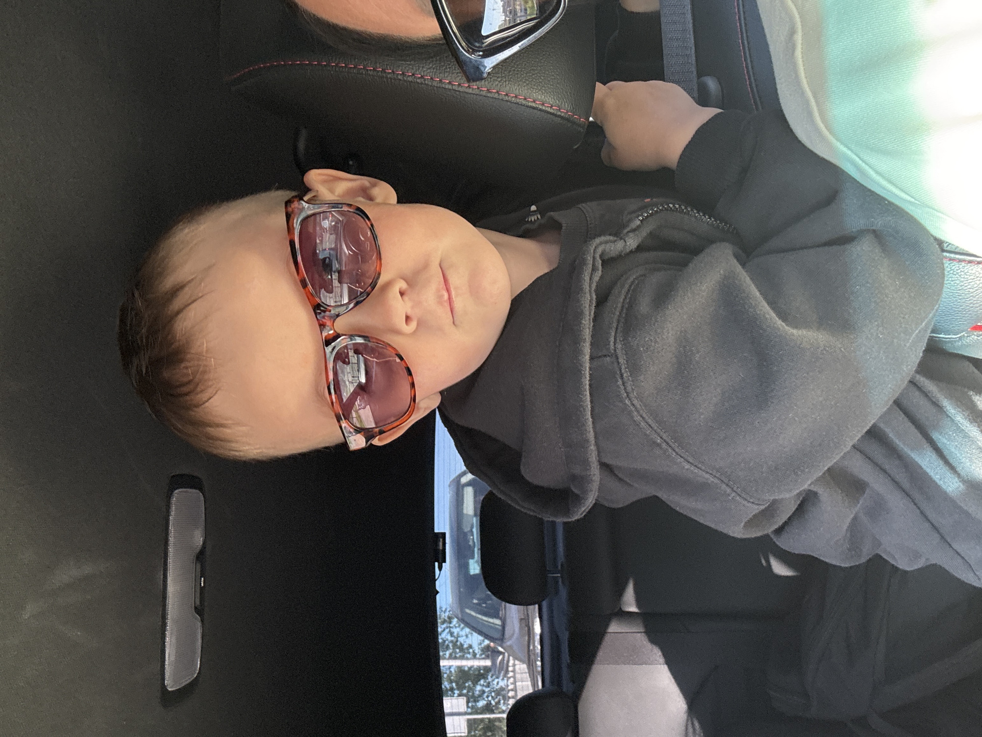 Woman and child spotted in car wearing sunglasses in Chaikovsky