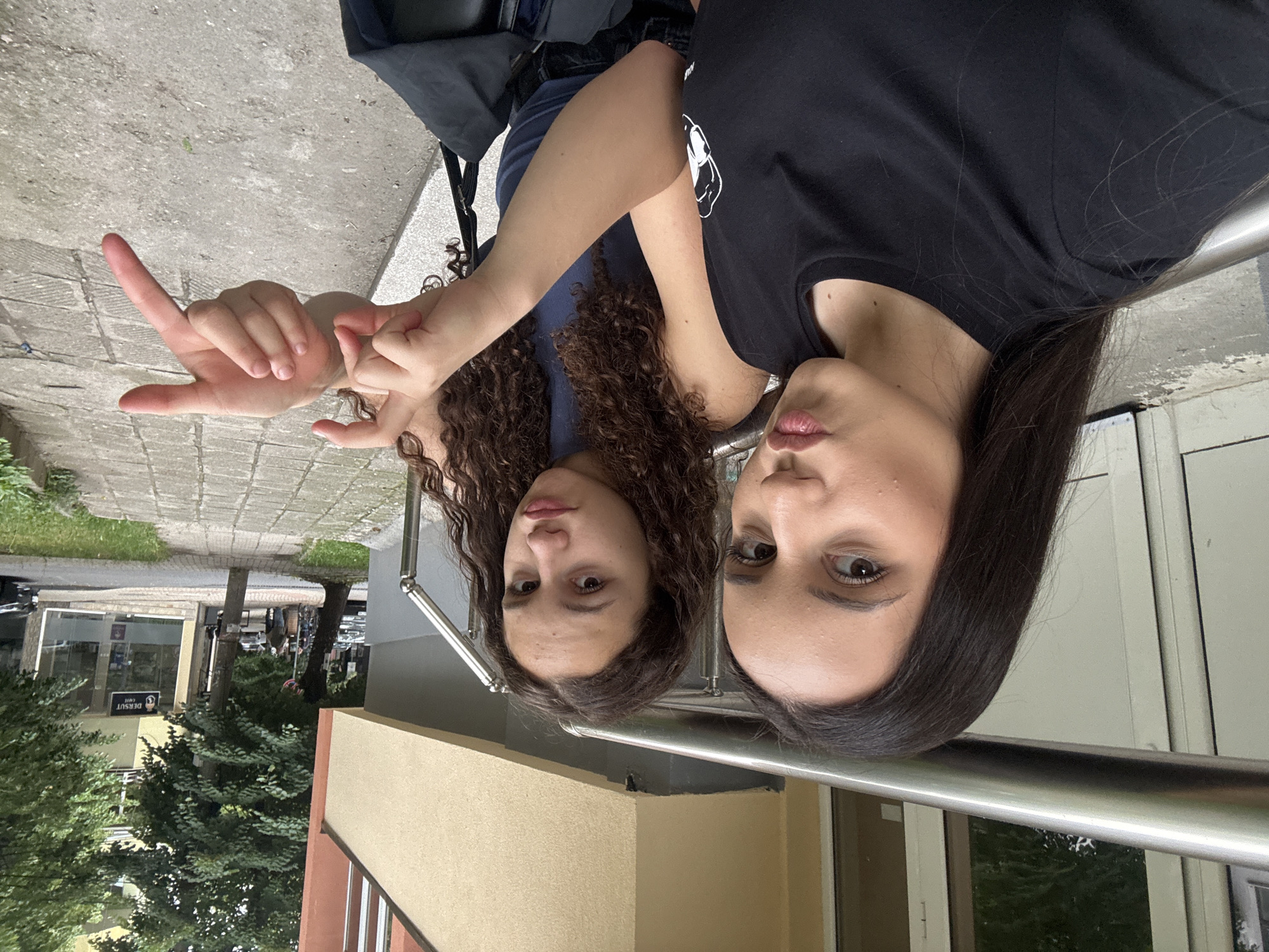 Selfies and candid moments outside near a black station wagon