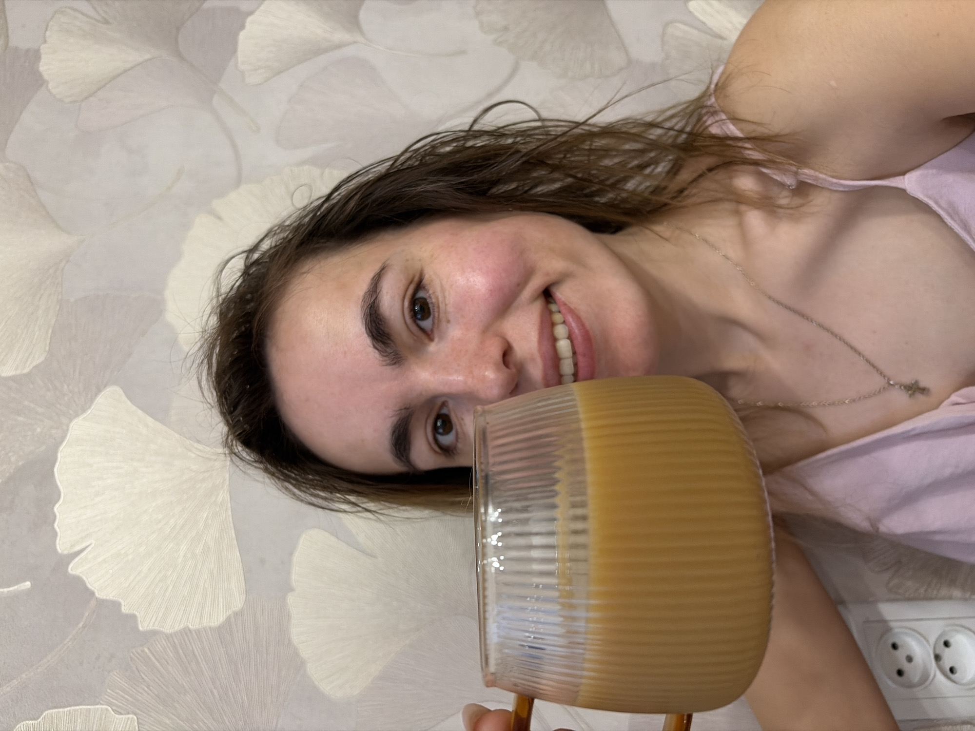 Woman enjoys morning coffee and pancakes in Izhevsk