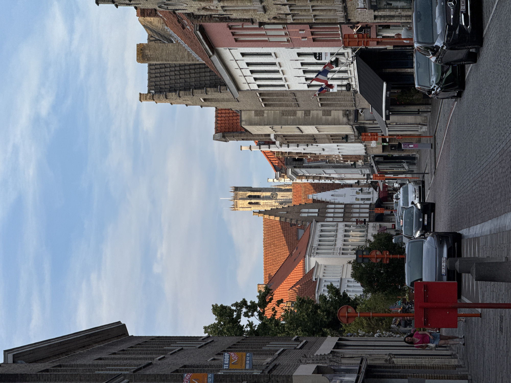 Bruges cobblestone street with the Belfry in view