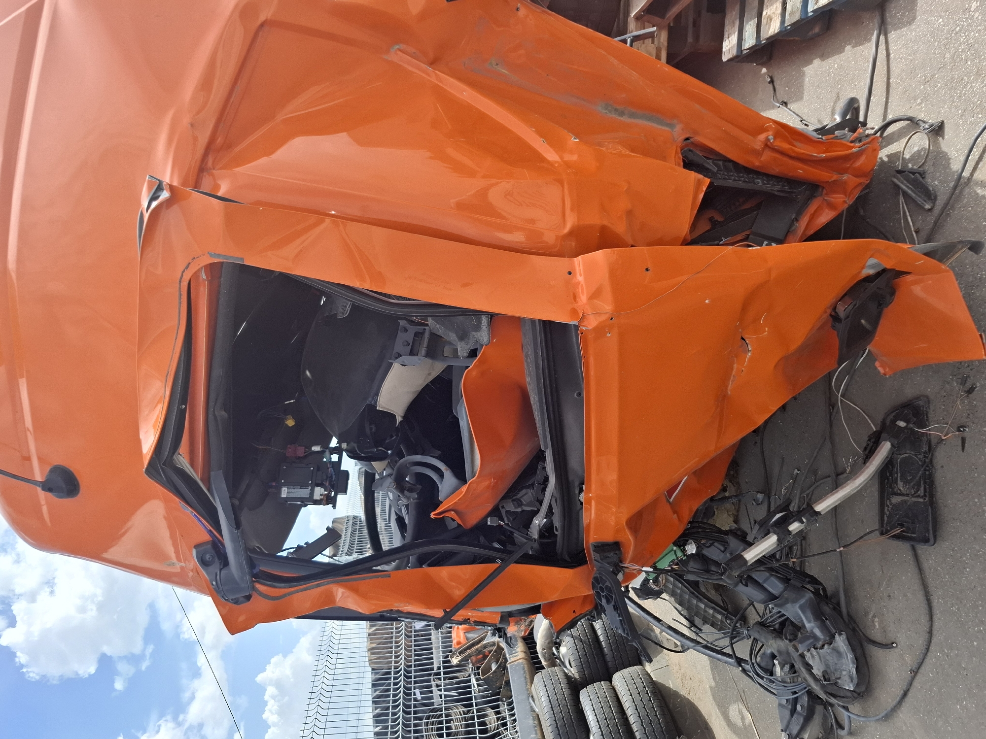 Truck depot maintenance and damaged vehicle documented in Izhevsk