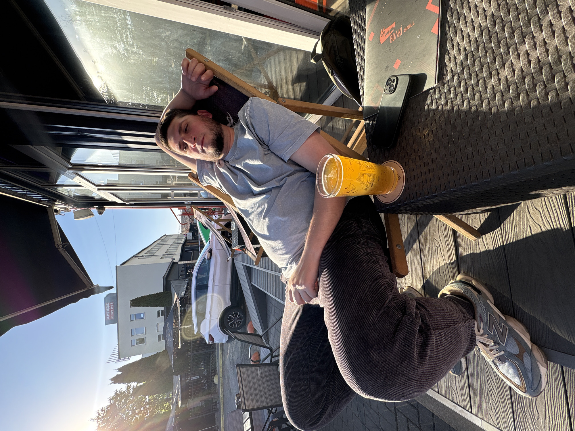 Man enjoys afternoon beer and fries at Minsk cafe