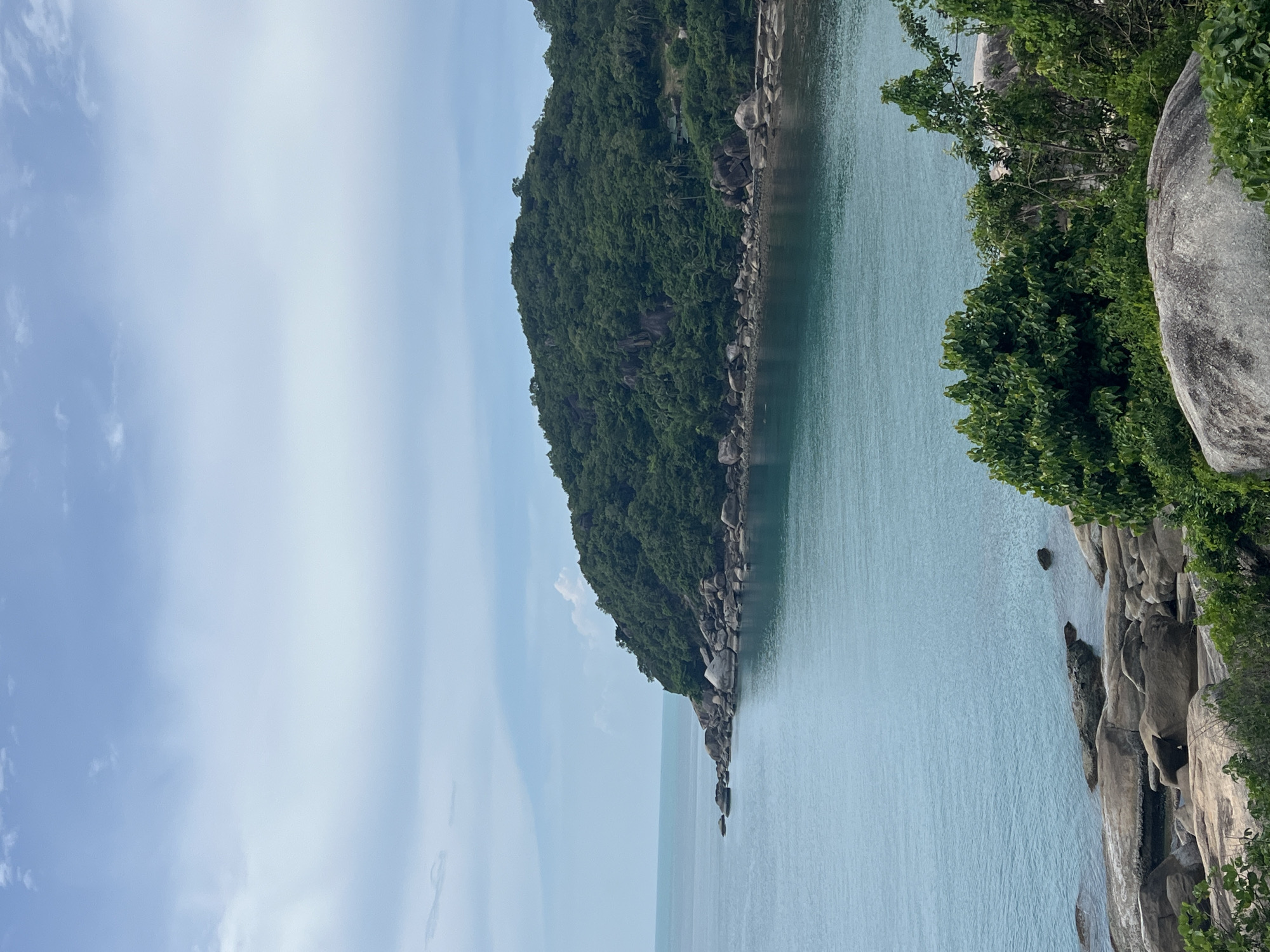Granite boulders and turquoise water along Baan Chaweng Noi's rocky coast