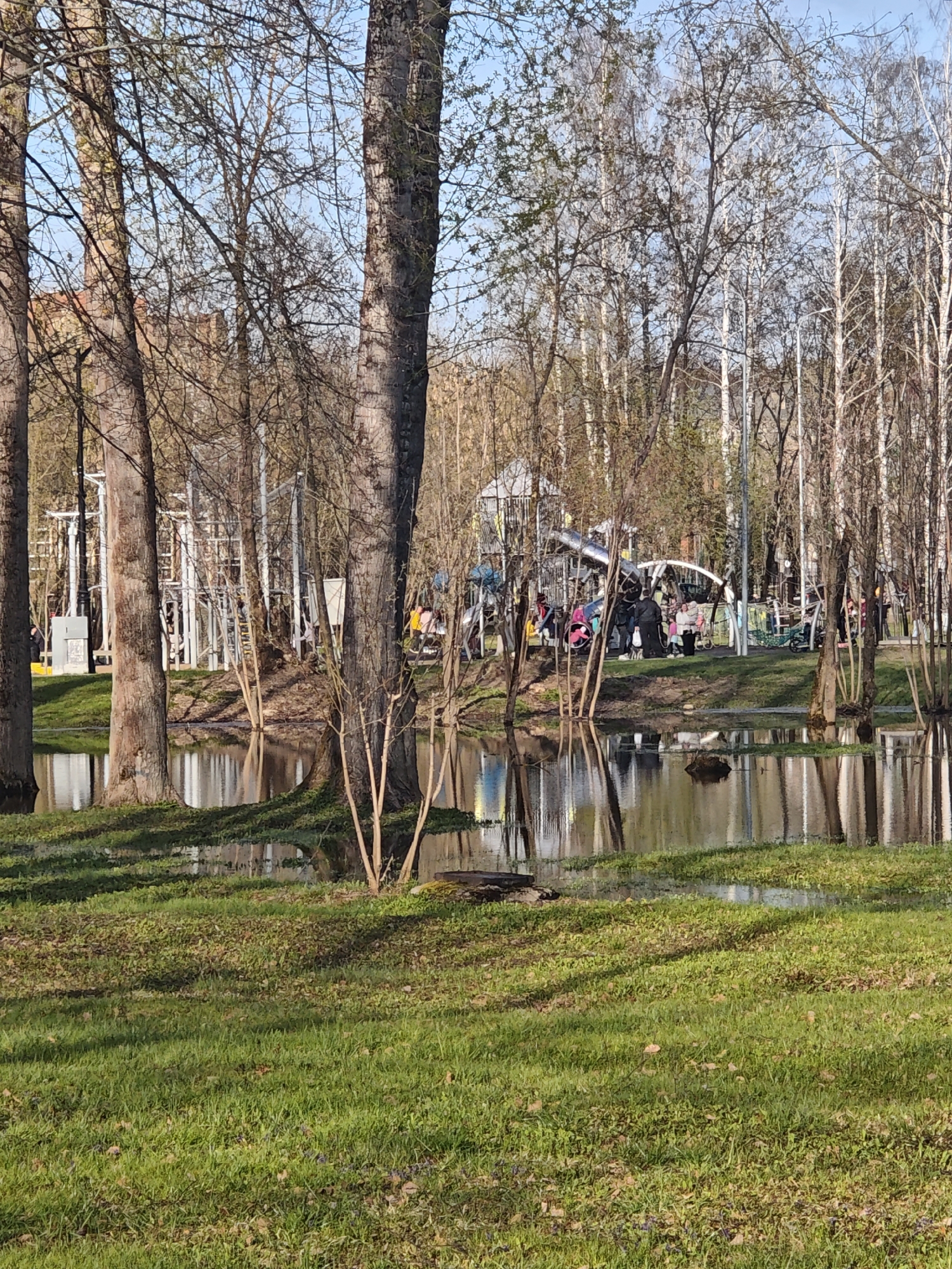 Spring afternoon leisure activities captured along flooded waterfront park
