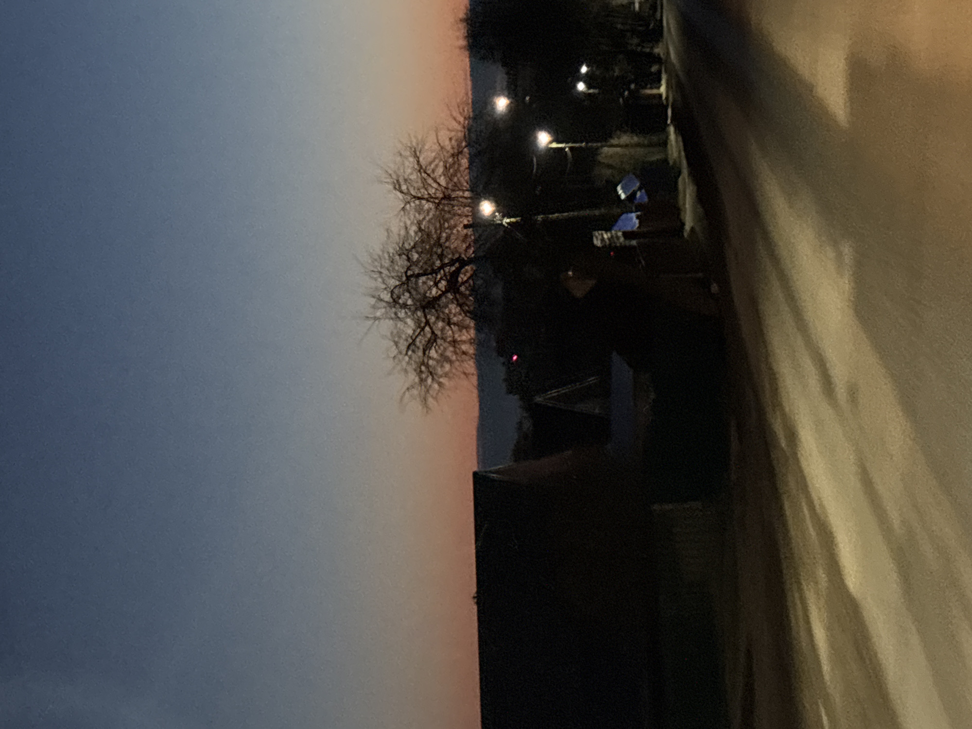 Evening street scene captured at dusk in Chaikovsky, Russia