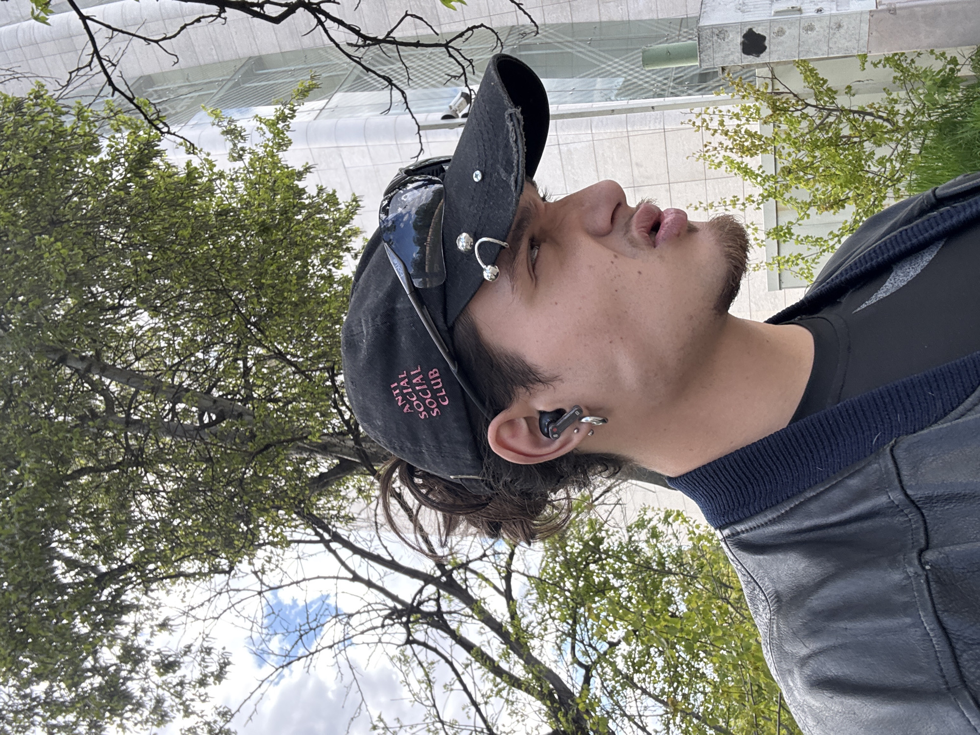Young man photographs himself at Sofia University campus
