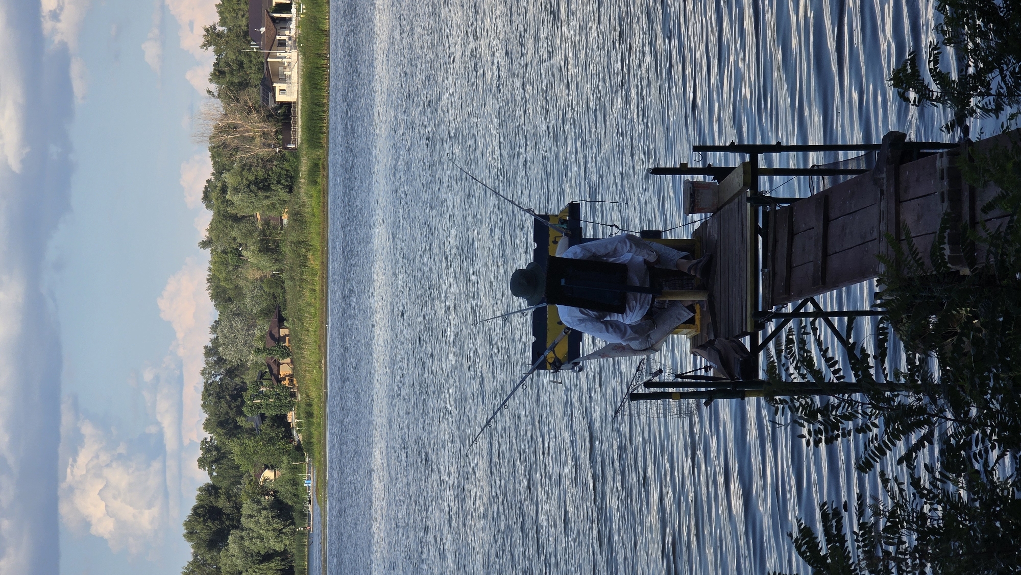 Fishing pier and cargo barge on a Kyiv river