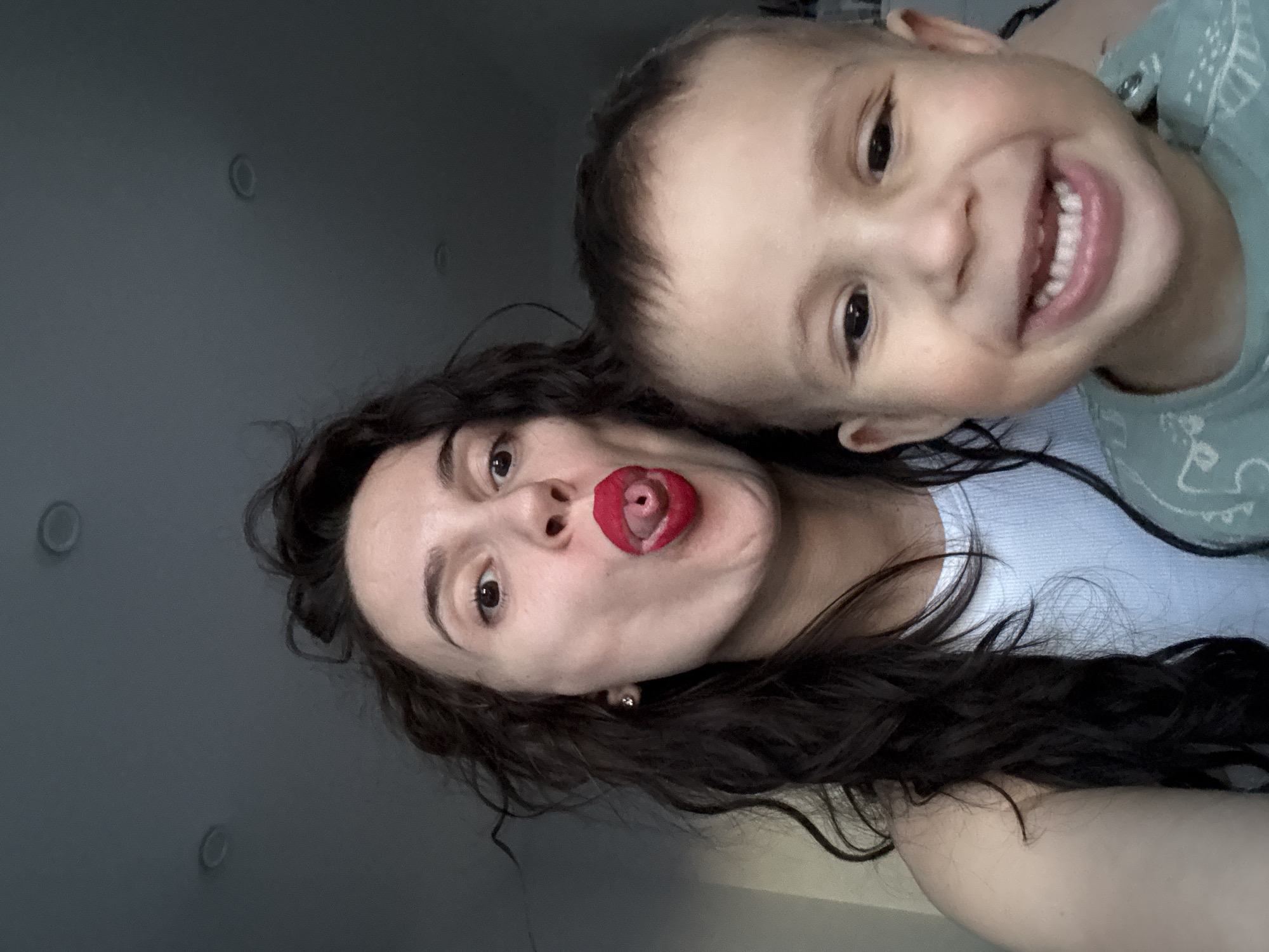 Woman and child share playful selfie moment in Chaikovsky