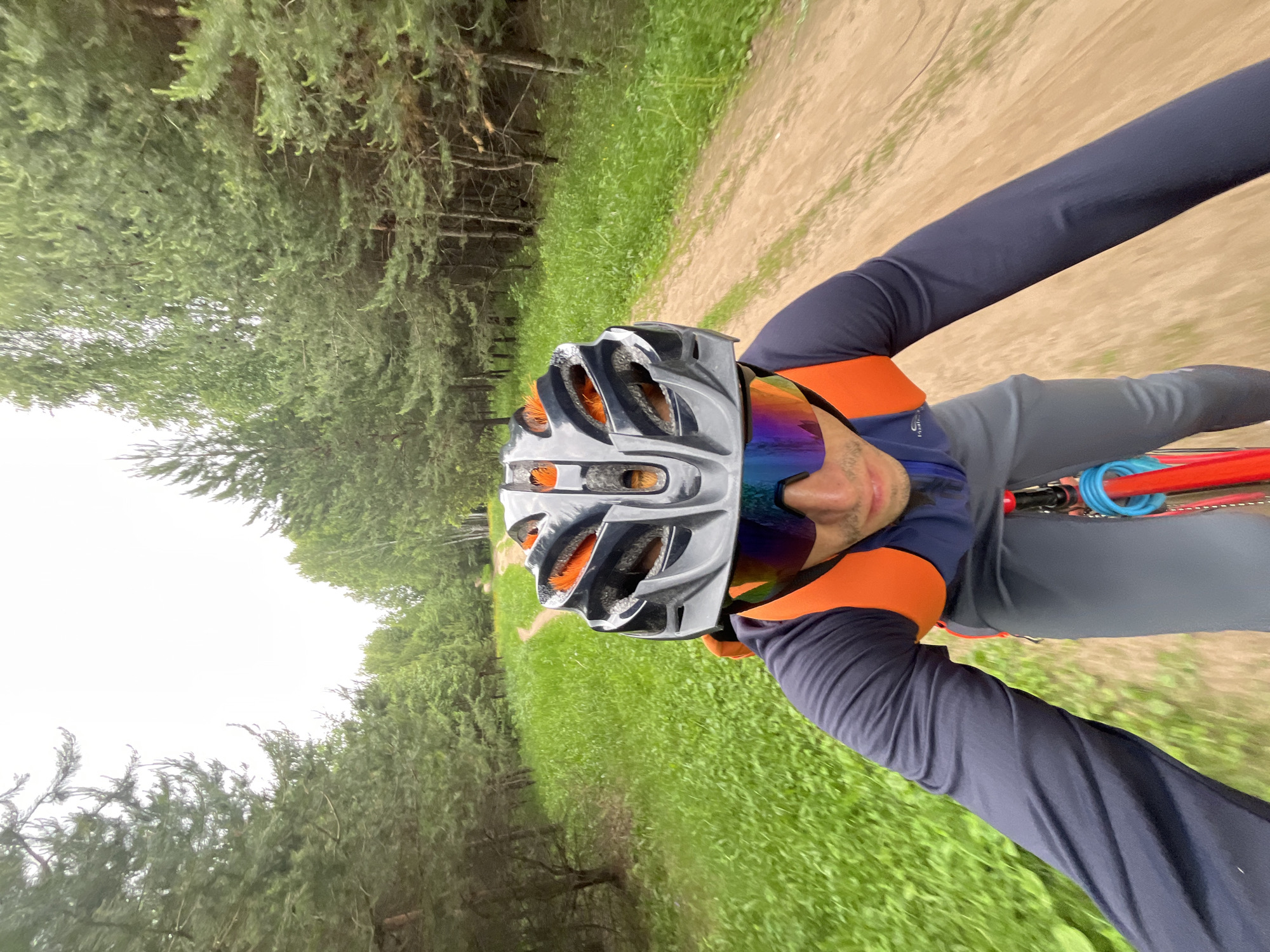 Cyclist rides forest path in Chaikovsky, Russia