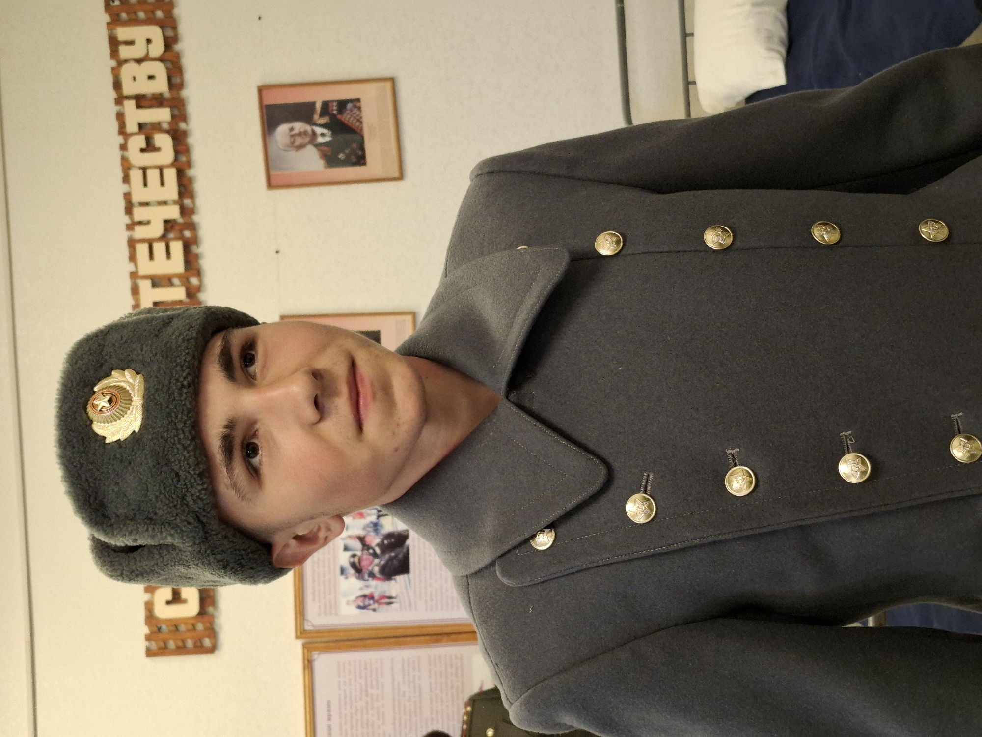 Man in Soviet-style military attire observed indoors in Russia