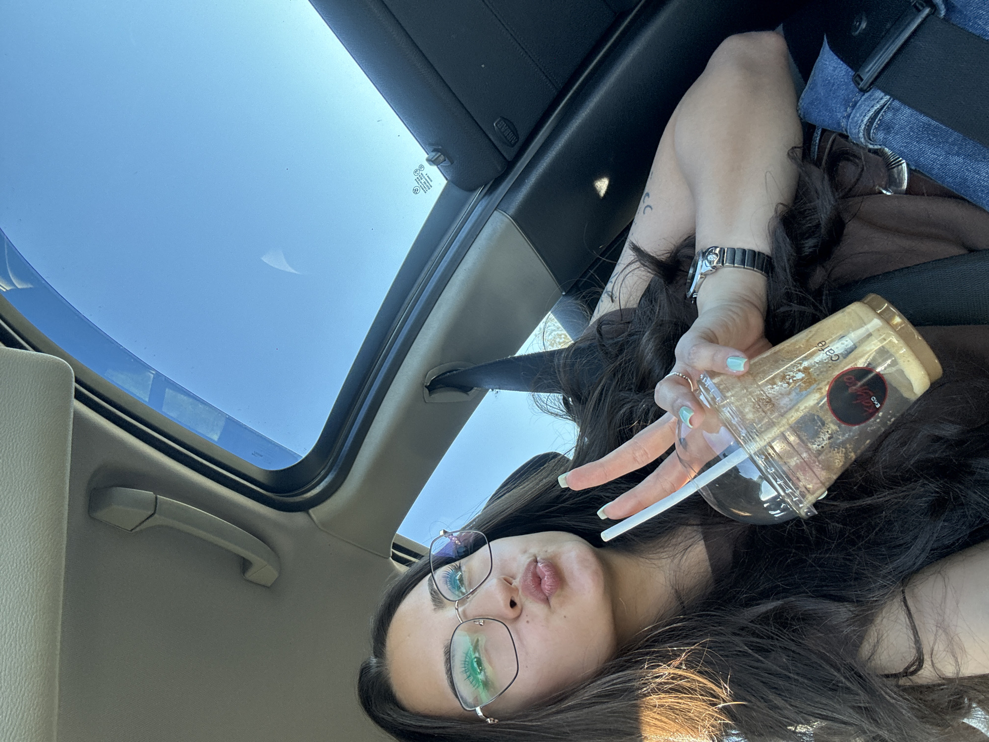 Woman photographed in car with open sunroof in Piperevo