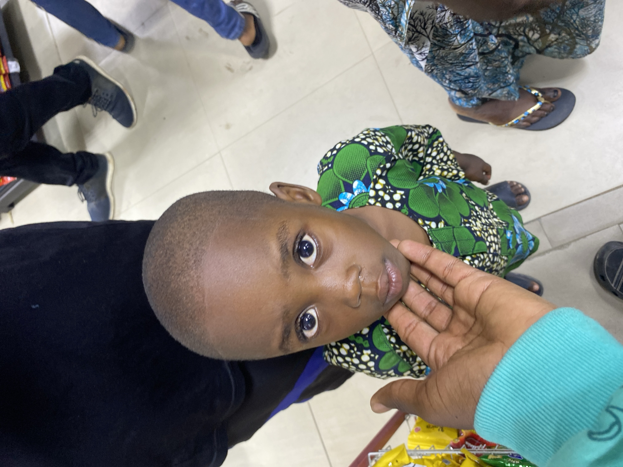 Child browses snack aisle in Lagos supermarket