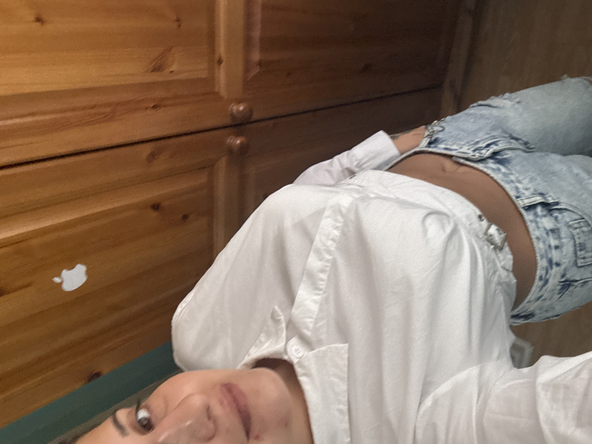 Casual indoor portrait in Armagh, white shirt and denim shorts