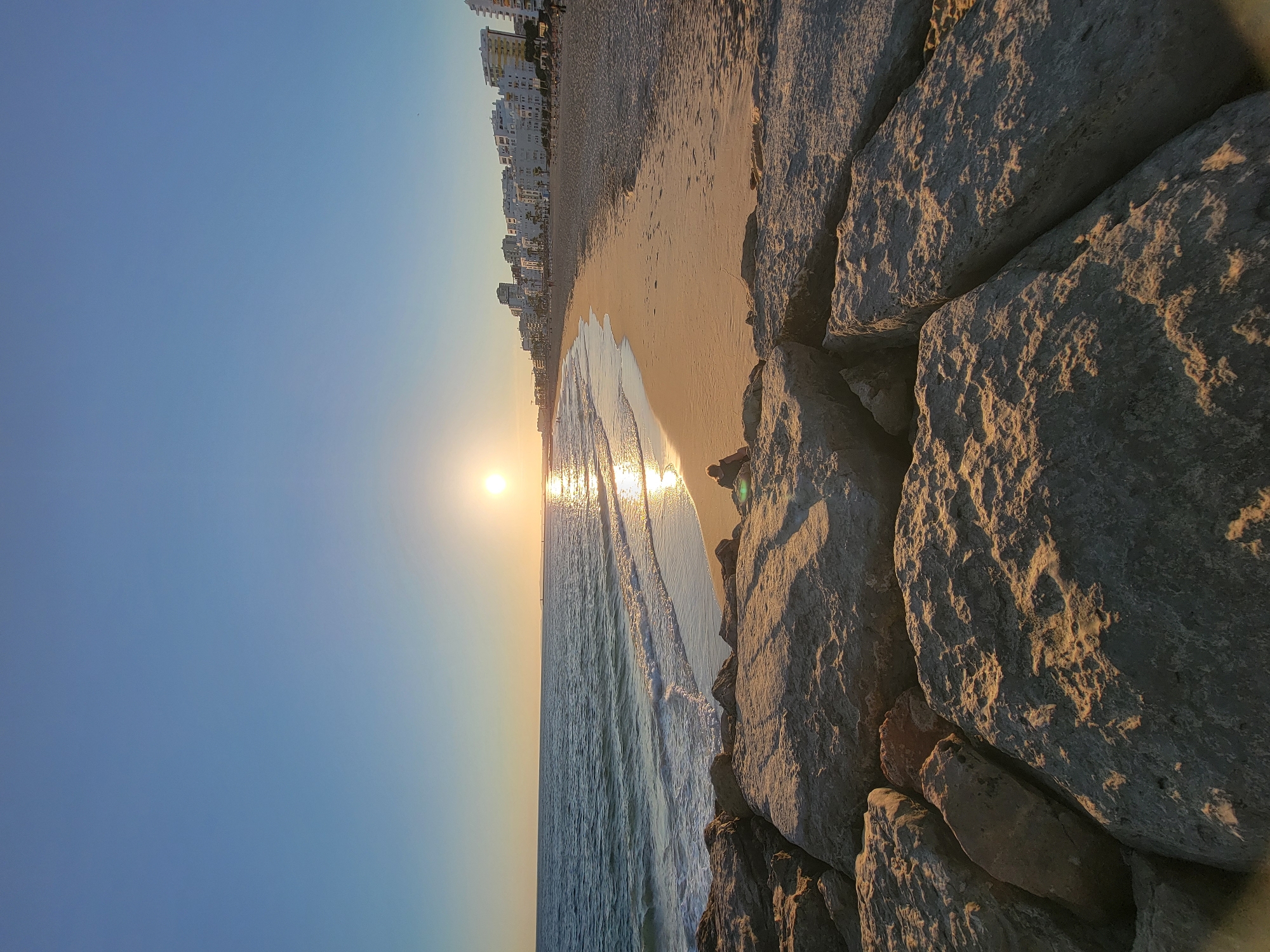 Golden hour on Quarteira beach, Portugal