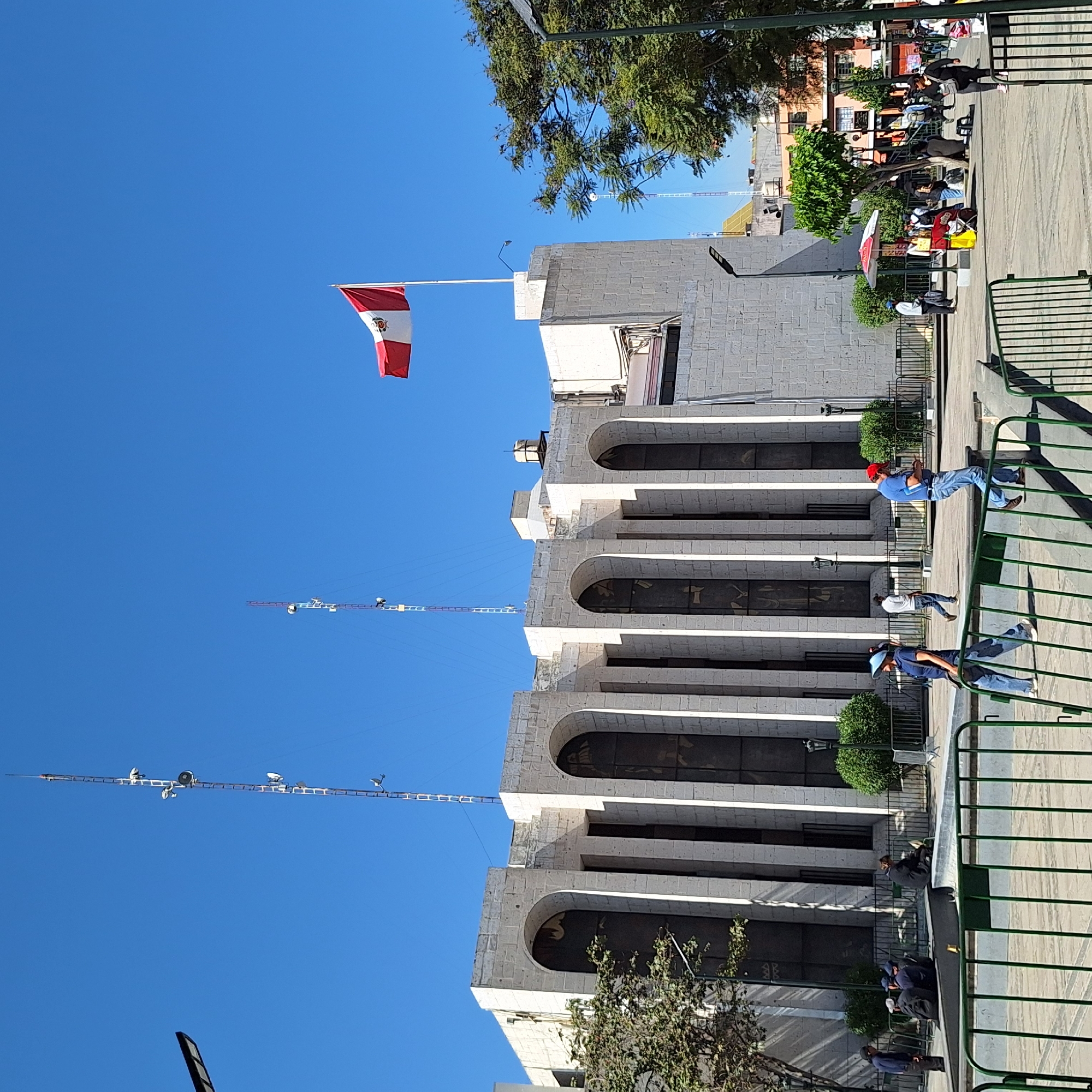 Stone building with Peruvian flag observed in Arequipa