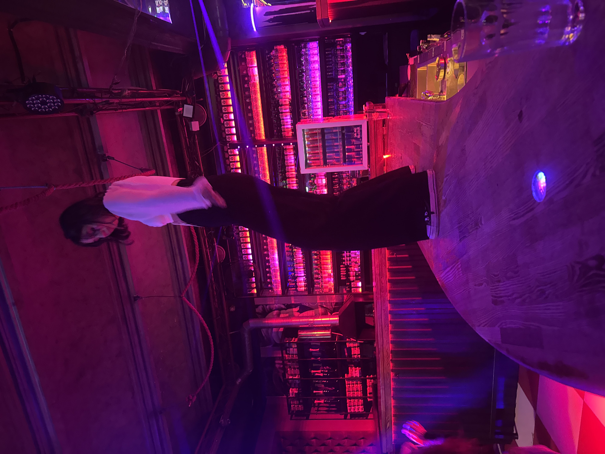 Late-night dancing at a neon-lit bar in Perm, Russia