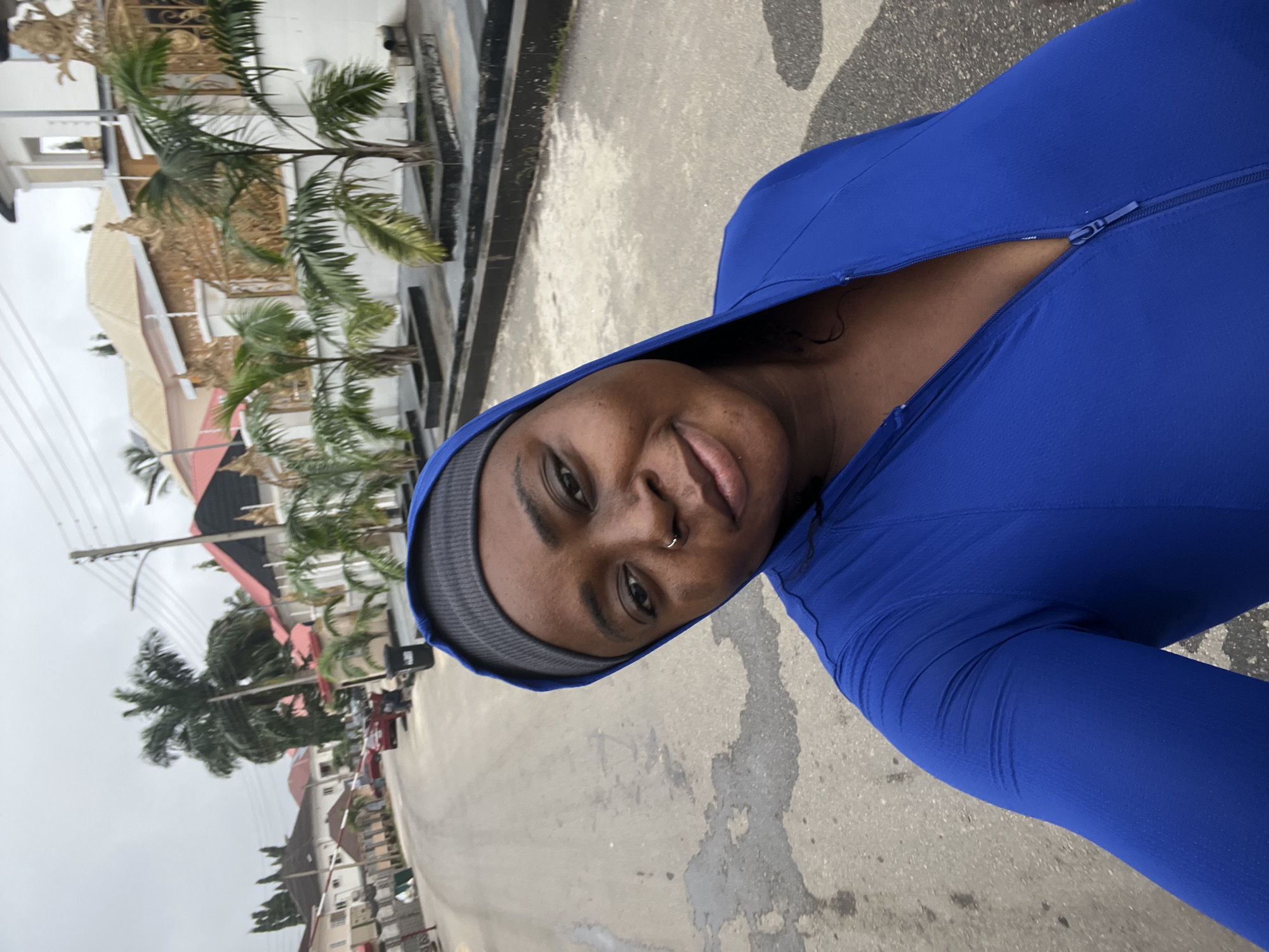 Morning street life along a paved road in Abuja