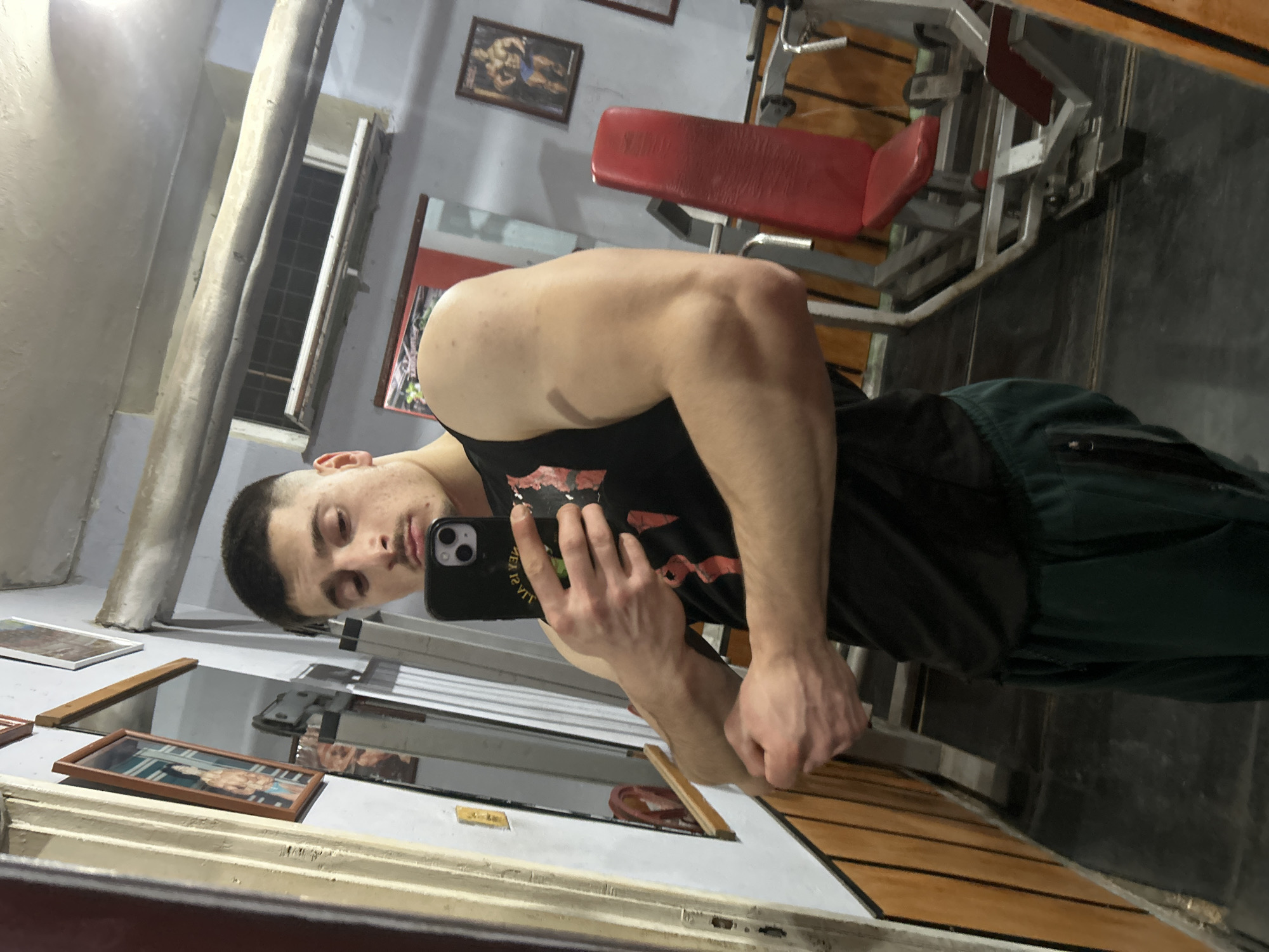 Person Takes Gym Selfies During Evening Workout Session