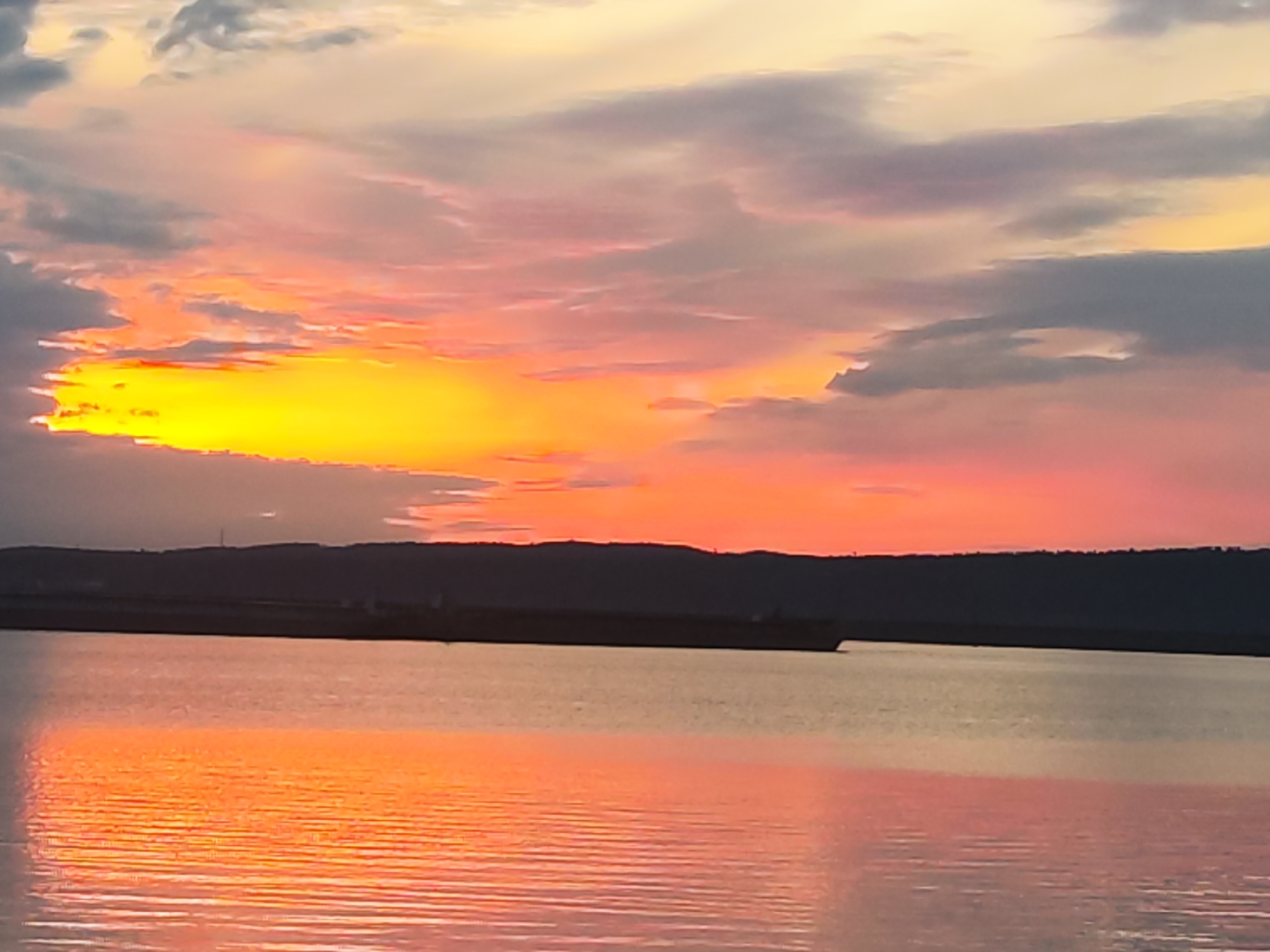 Dramatic sunset over Kama River captured in Chaikovsky, Russia