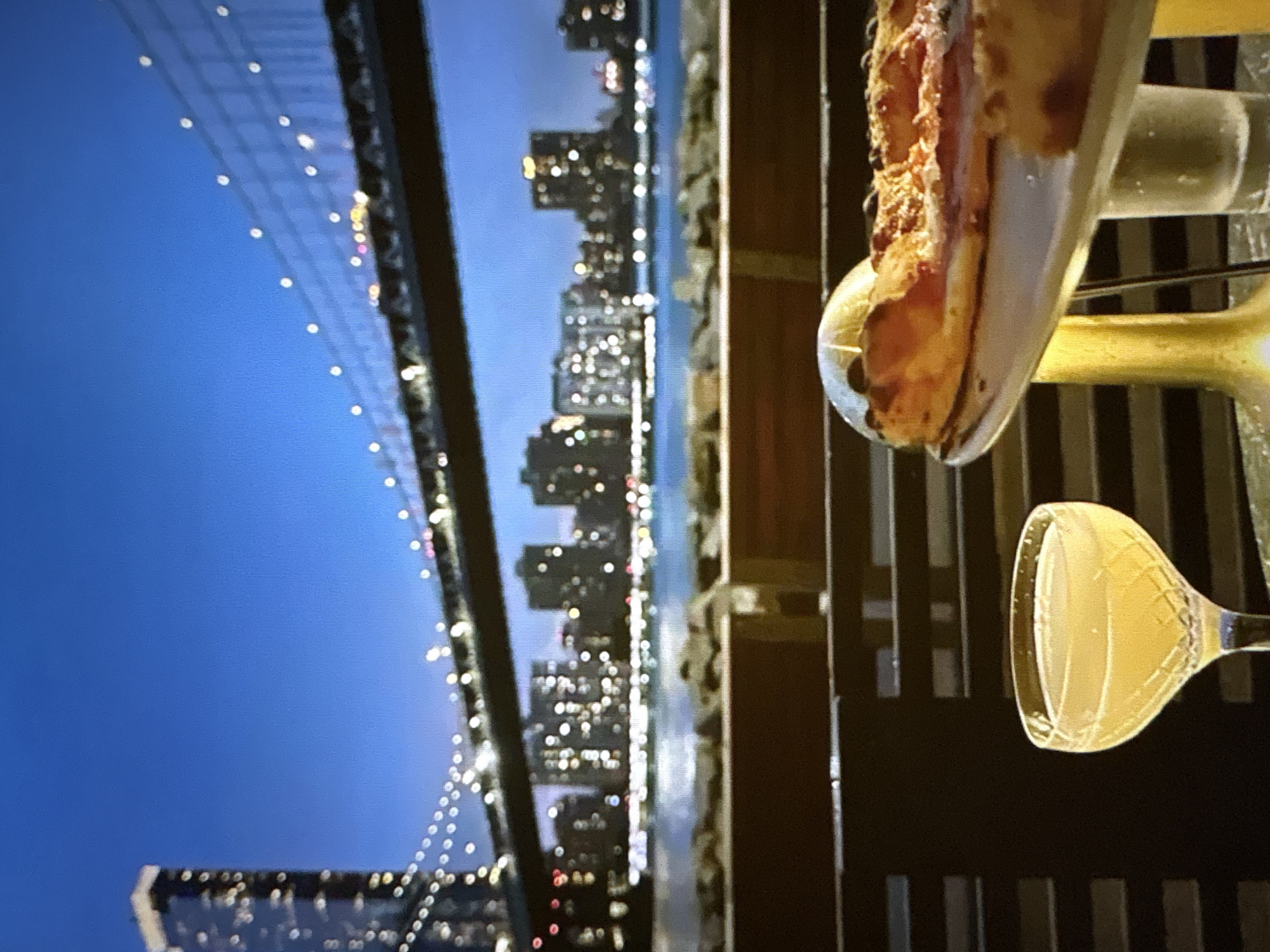 Pizza and cocktails with a nighttime Pori waterfront view