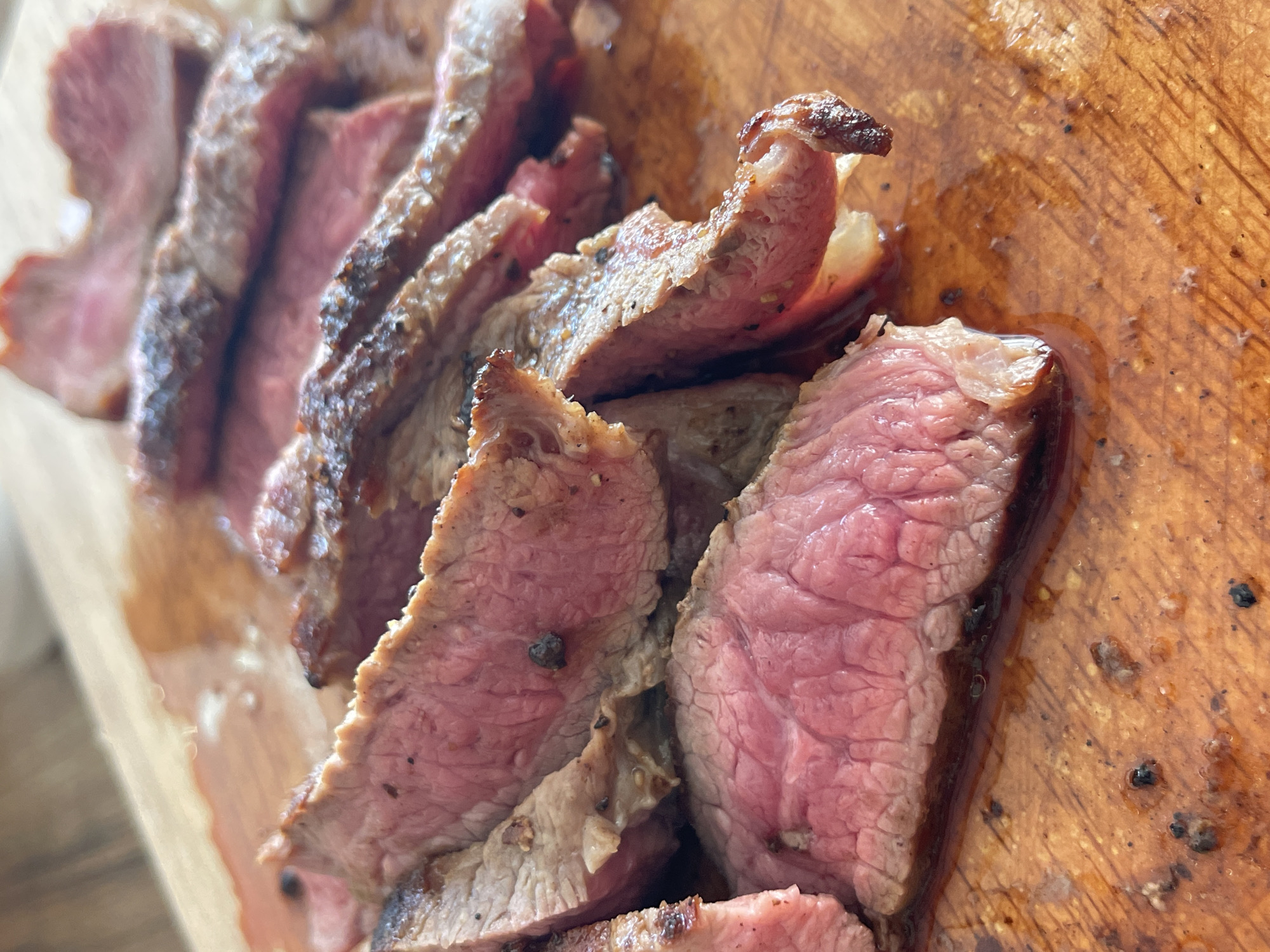 Medium-rare steak being sliced and served in Karlovo