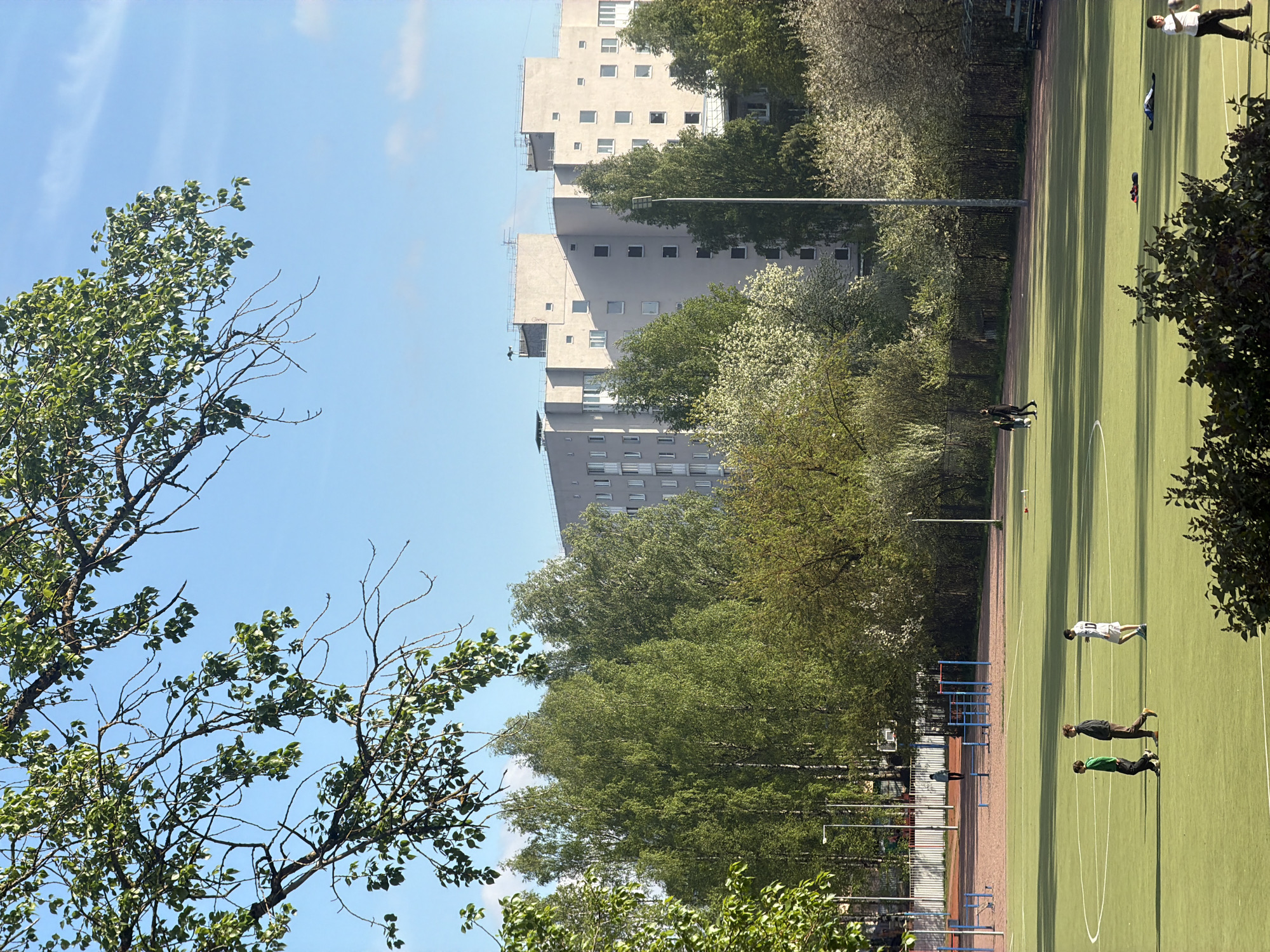 Children play on sports field in Russian residential district