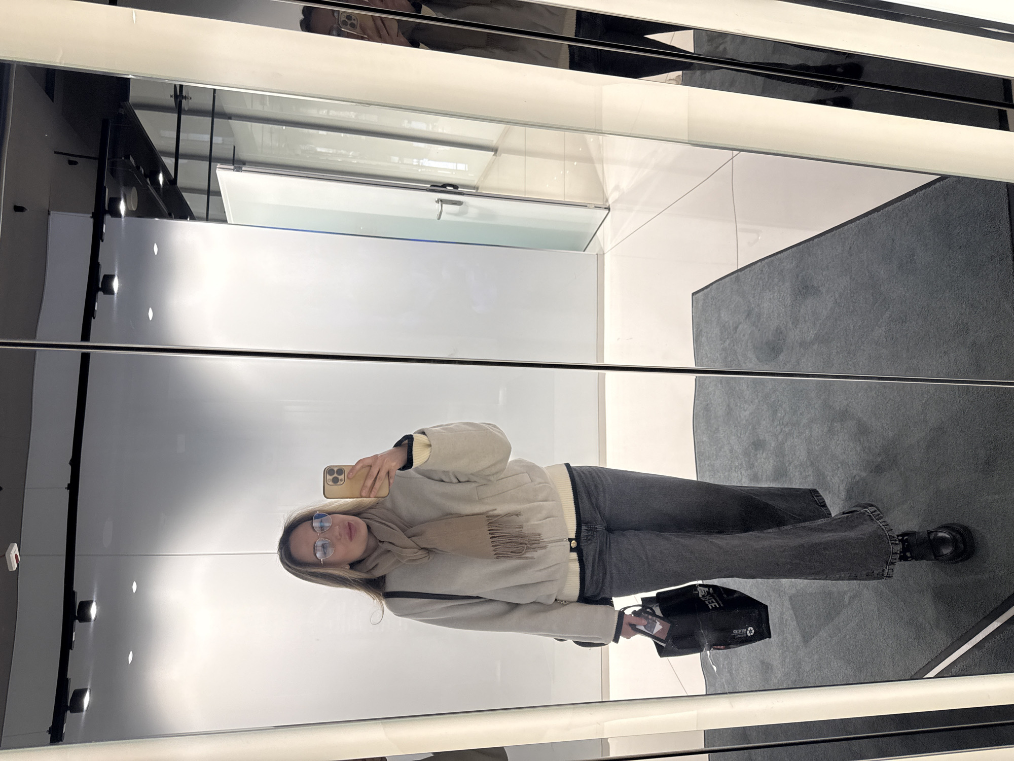 Woman Takes Selfie in Riga Commercial Space Early Morning