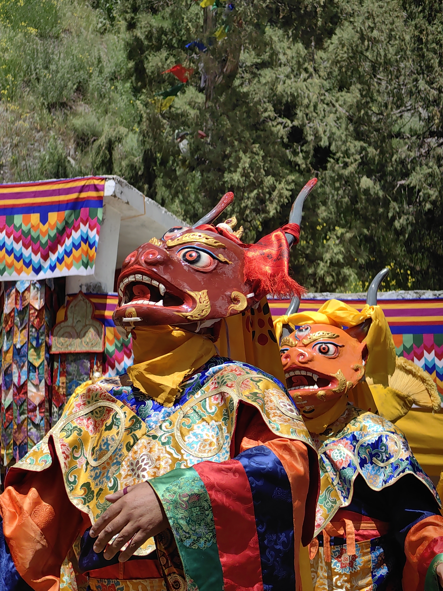 Masked ritual dancers perform at a Keylong festival