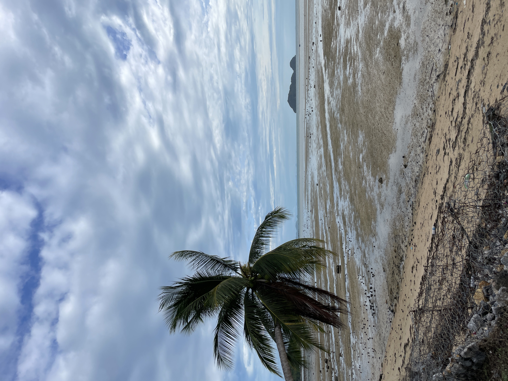 Beach photography session captures low tide scene in Thailand