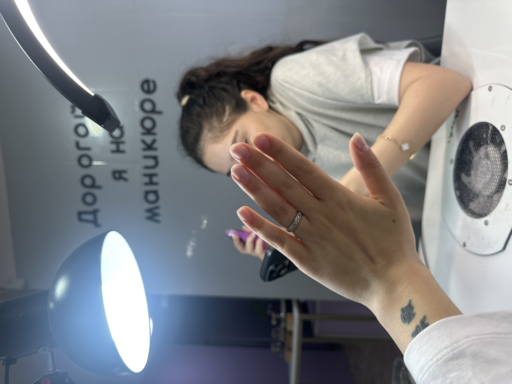 Woman gets manicure in early morning Yerevan salon