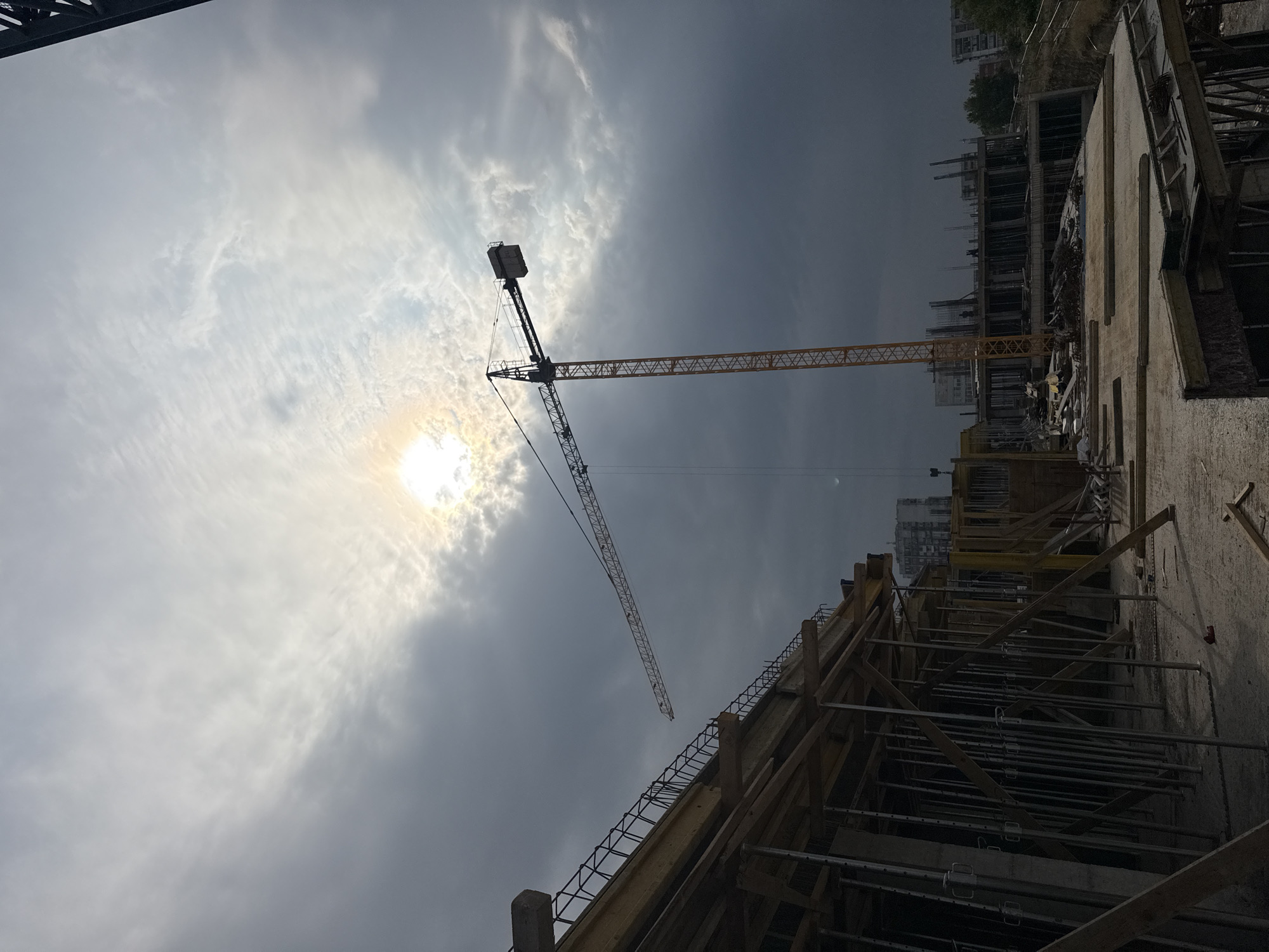 Active construction site in Varna with crane and excavator at work