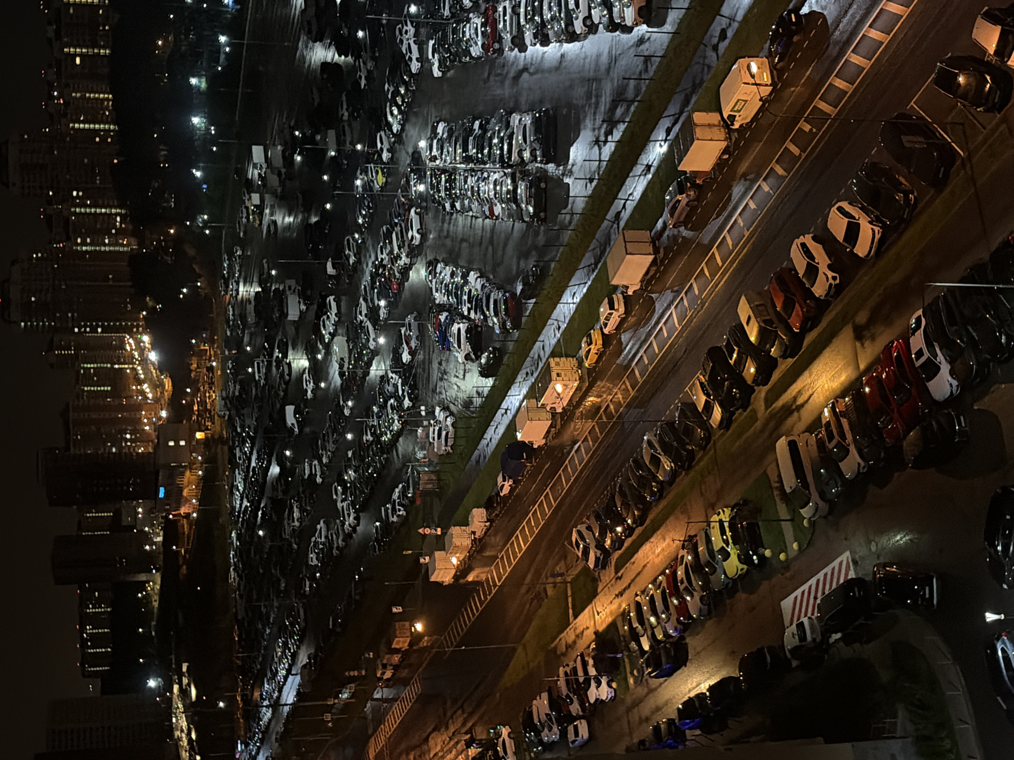 Night aerial views over Moskovskiy's residential blocks and parking lots