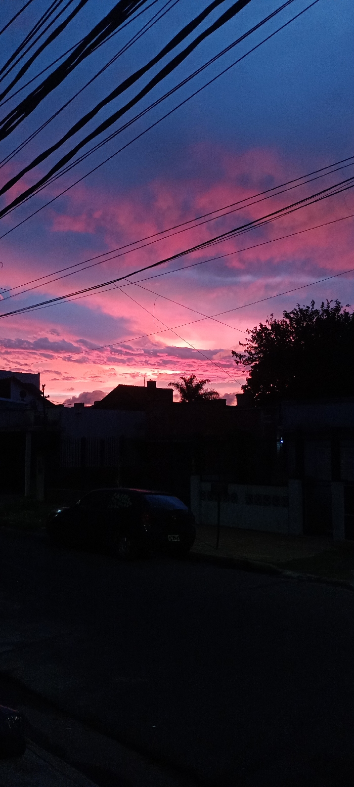 Colorful twilight rainbow illuminates Buenos Aires suburbs
