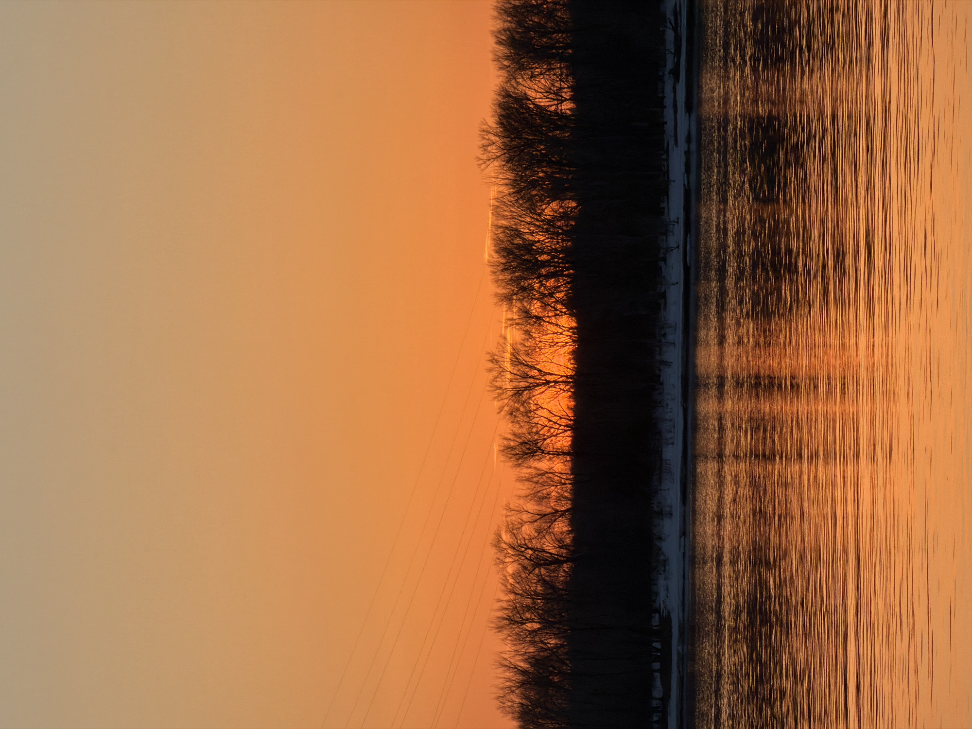 Winter fishing and sunset captured along Kama River, Chaikovsky