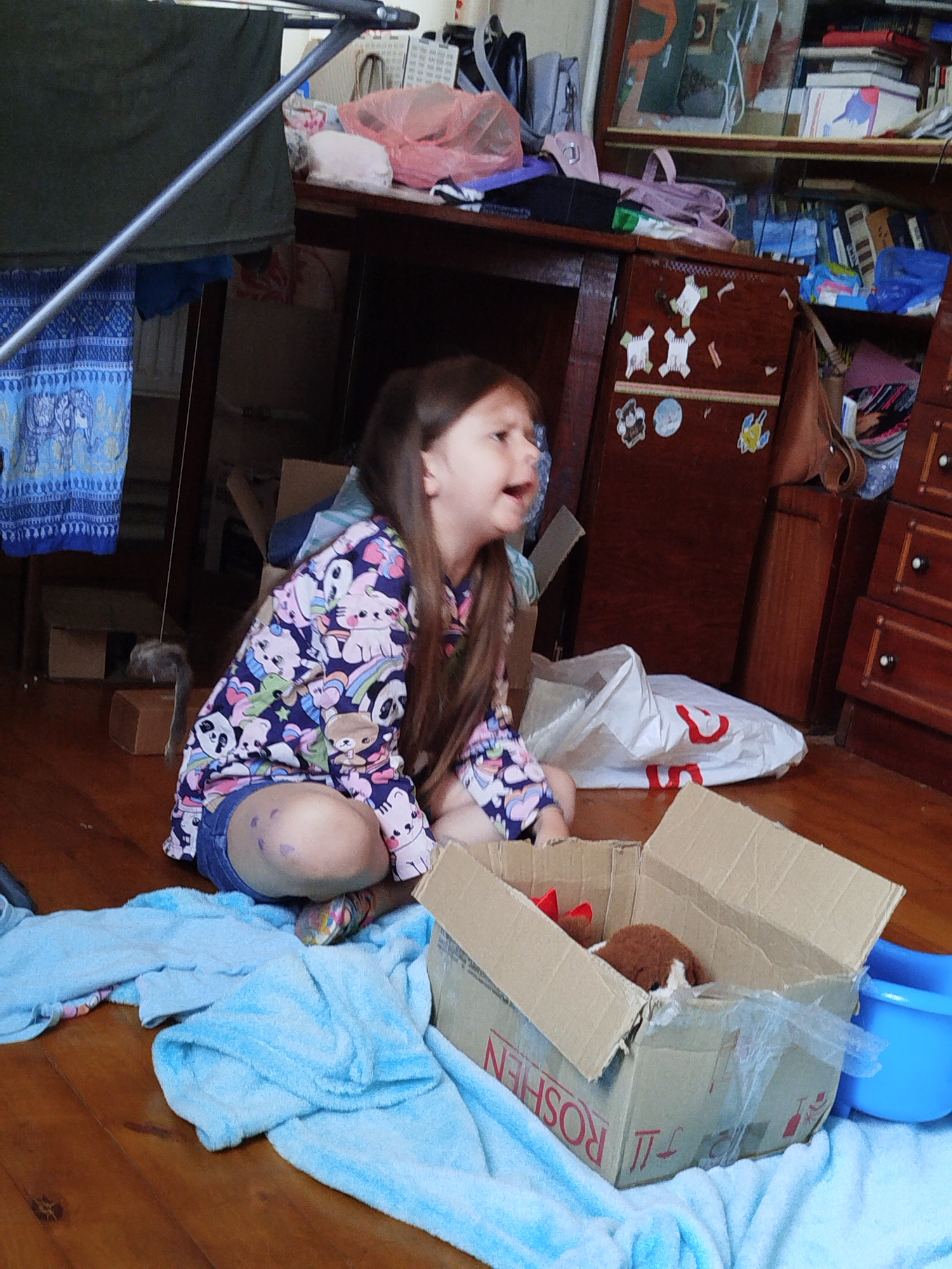 Indoor floor scene amid cardboard boxes, Vinnytsia home