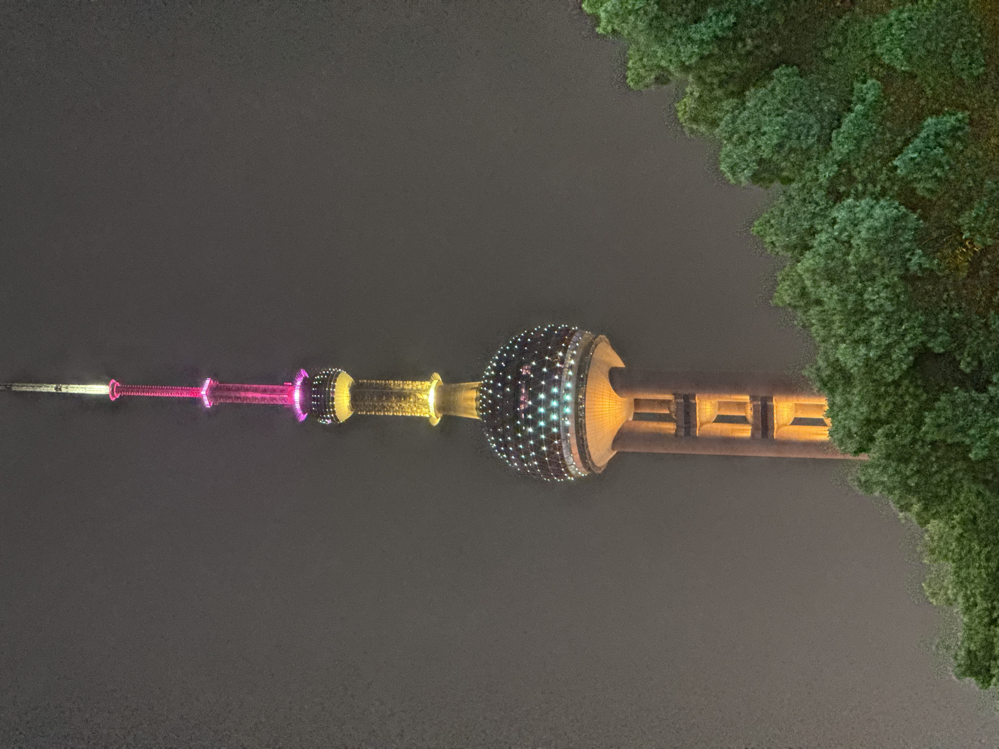 Shanghai nightlife captured around illuminated Oriental Pearl Tower