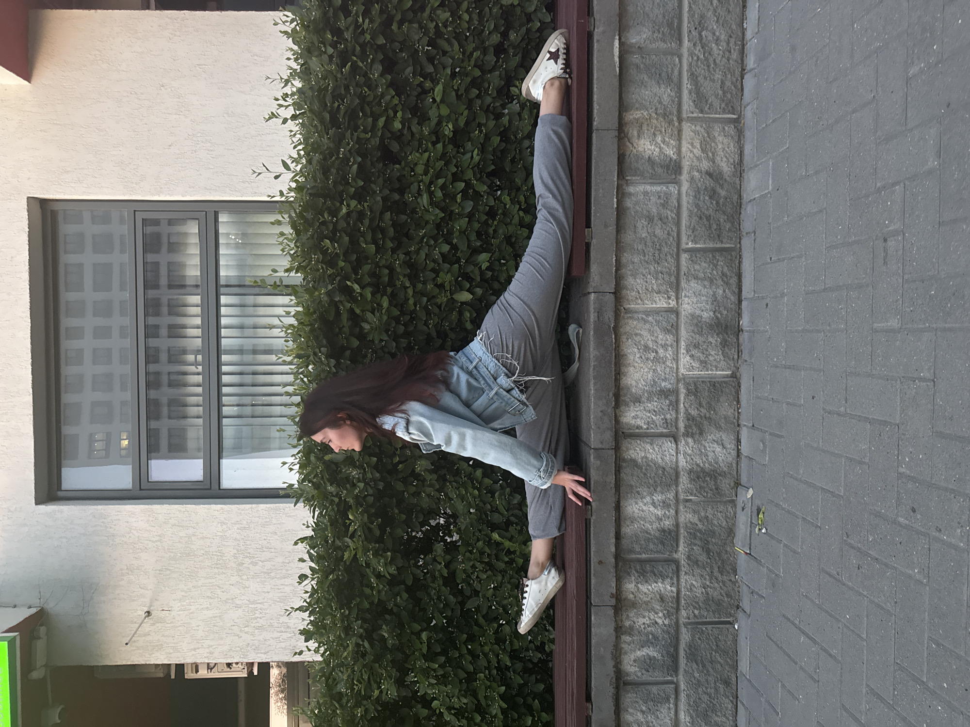 Woman performs athletic poses across multiple Tyumen locations