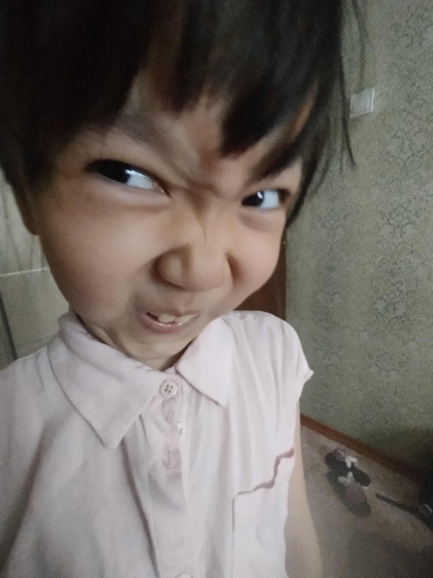 Kid pulls a fierce face in a close-up shot
