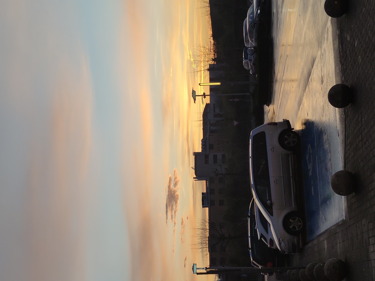 Car parked in handicapped space during sunset in Ruse