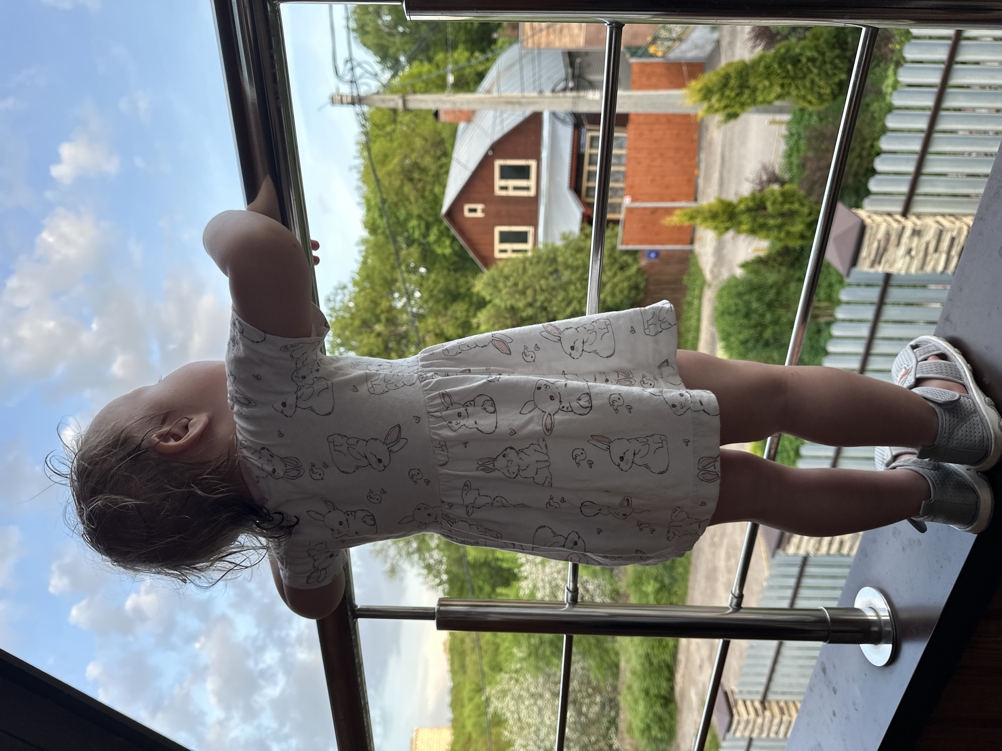 Children play on balcony under supervision in Nizhny Novgorod