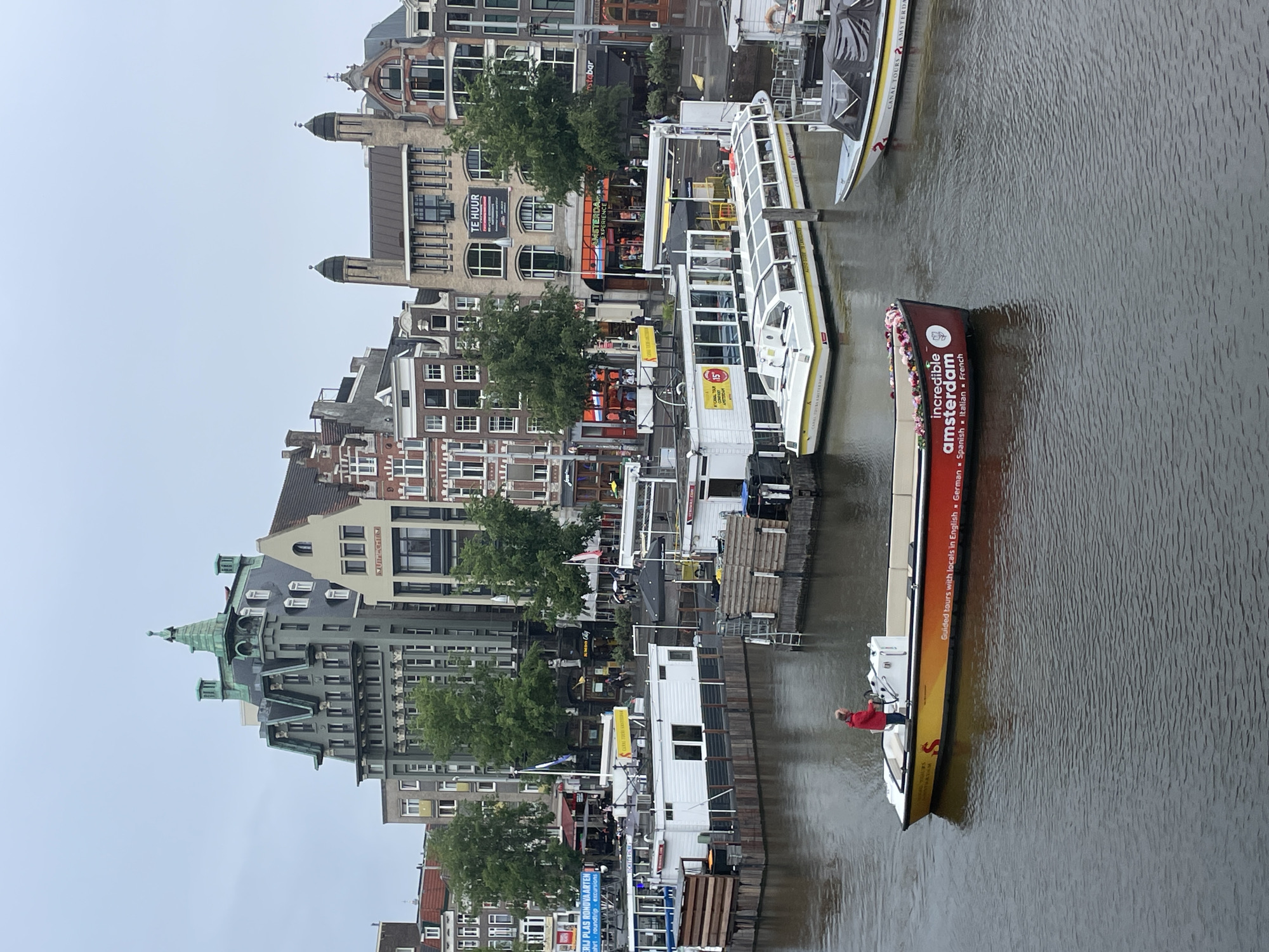 Amsterdam canal scenes documented during overcast afternoon