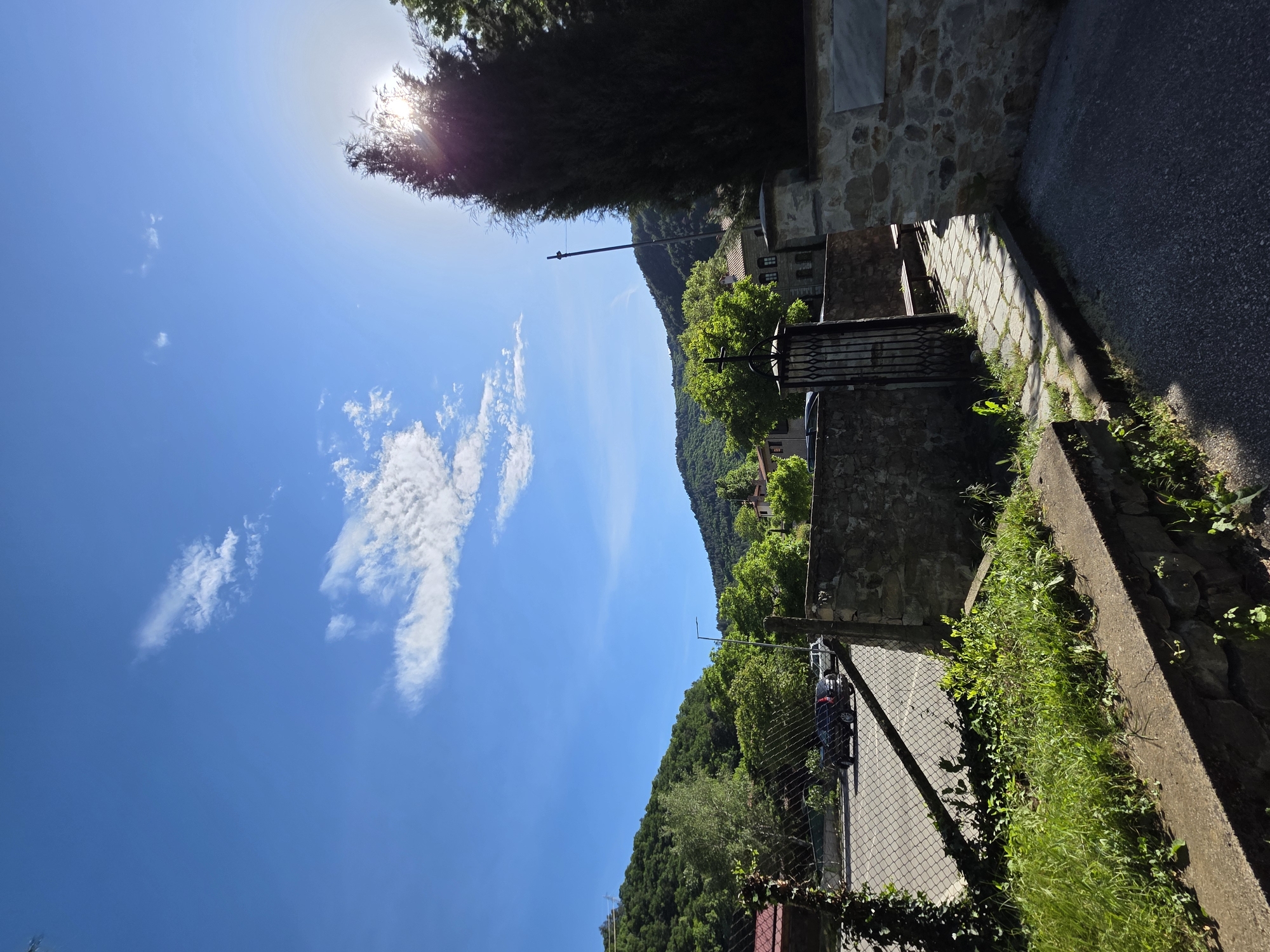 Tourist documents afternoon walk through historic Bachkovo, Bulgaria
