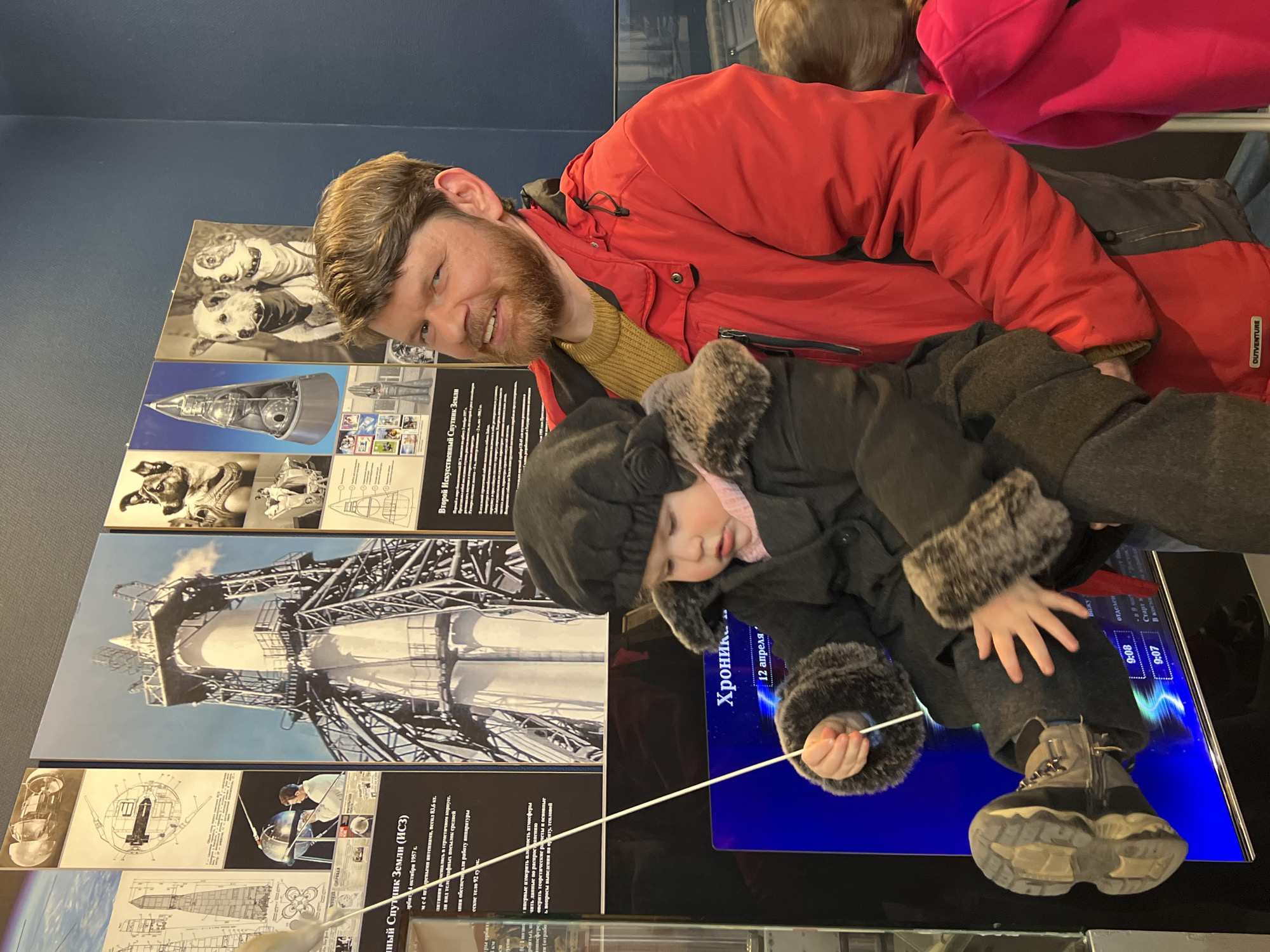 Father and child explore Soviet space museum in Saint Petersburg