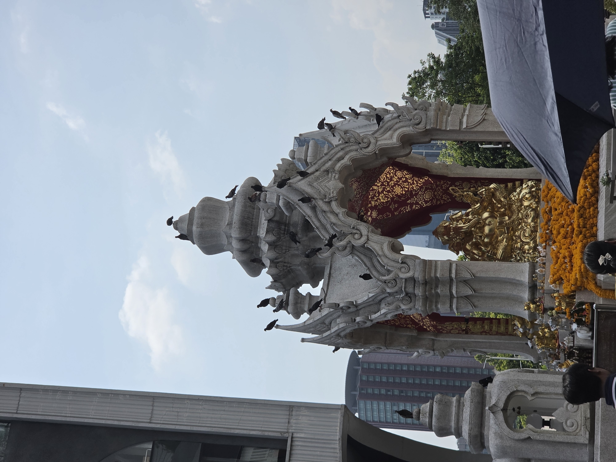 Morning activity documented at Bangkok's Erawan Shrine and vicinity