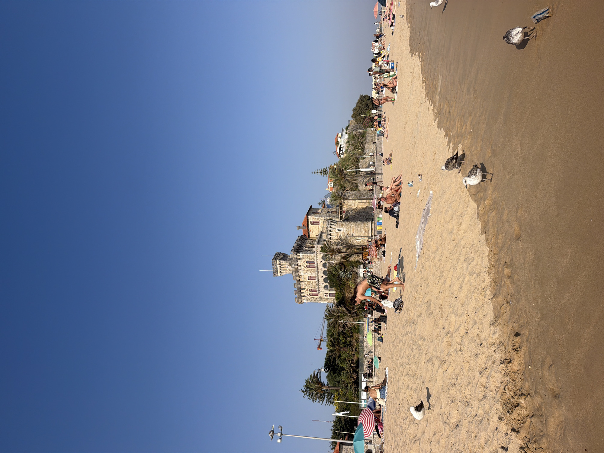 Crowded summer afternoon on the beaches of Cascais, Portugal