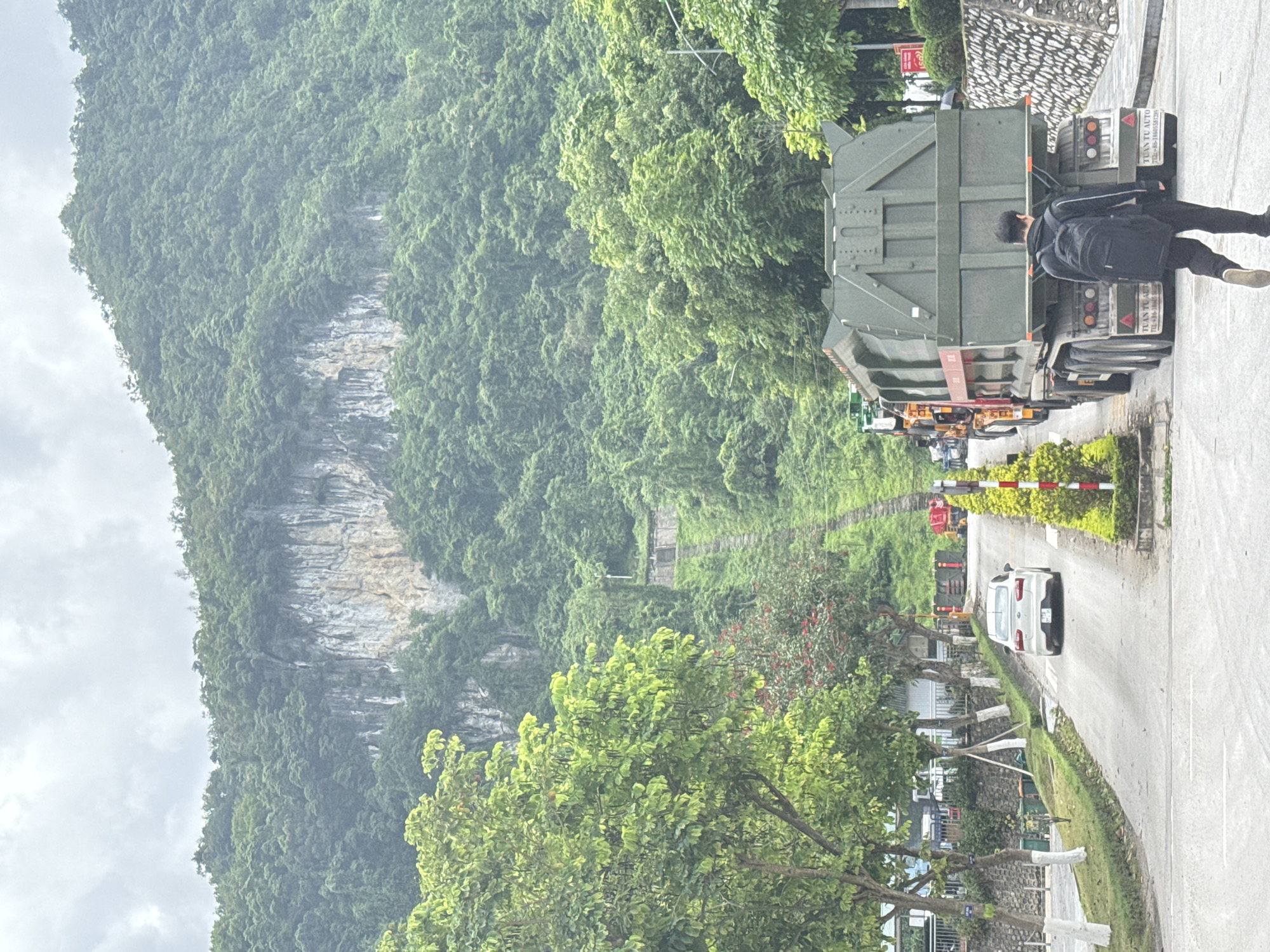 Semi-trucks parked near mountainous road in Đồng Đăng, Vietnam