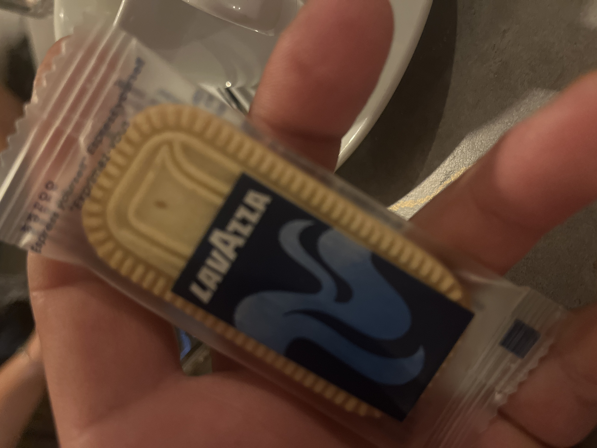 Lavazza branded cookie and Bulgarian promo pamphlet at a tasting